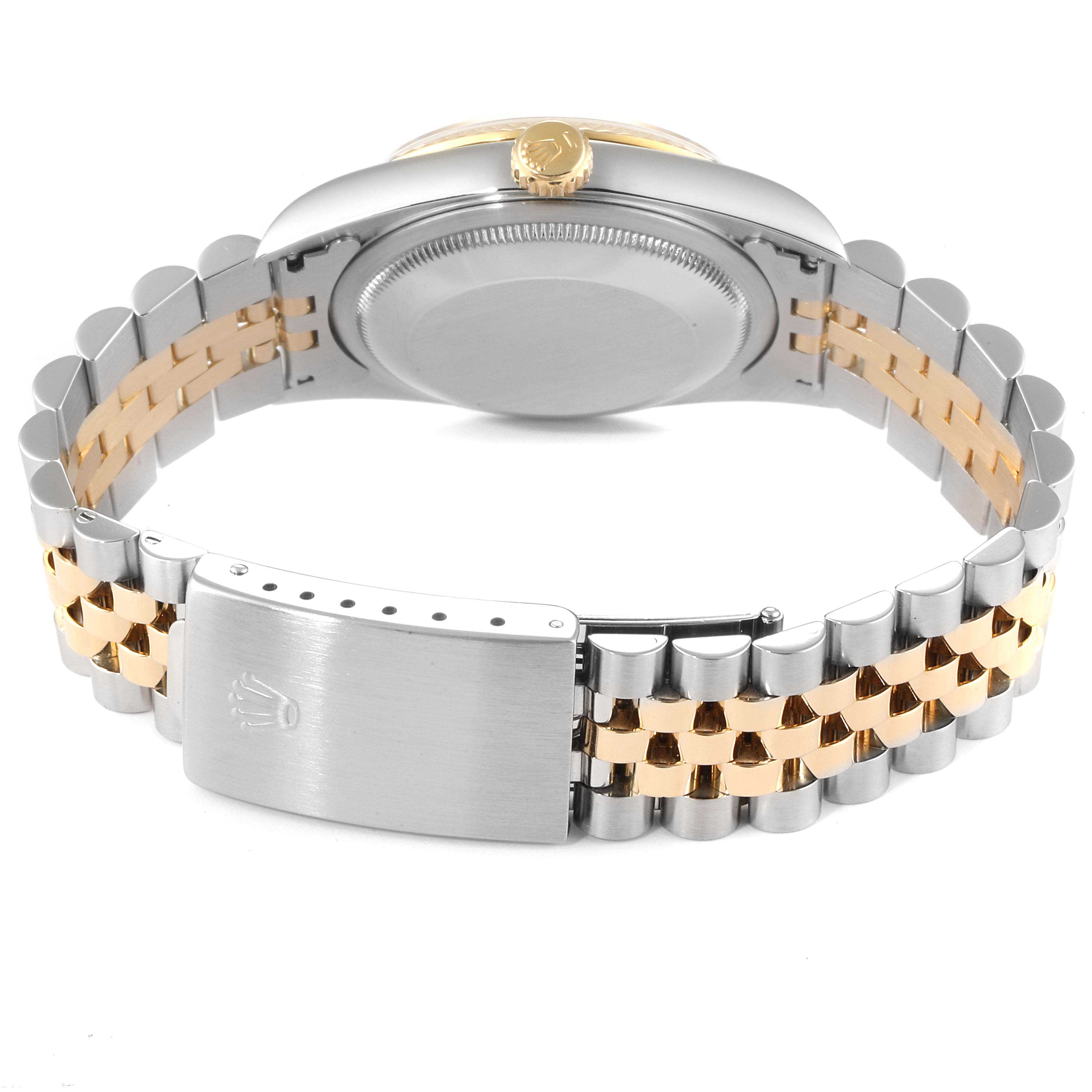 The image shows the back view of a Rolex Datejust 16233 Men
s Steel and Gold (two tone) Champagne Dial 16233 Men
s Steel and Gold (two tone) Champagne Dial watch, highlighting the case back, crown, and two-tone Jubilee bracelet with a clasp.