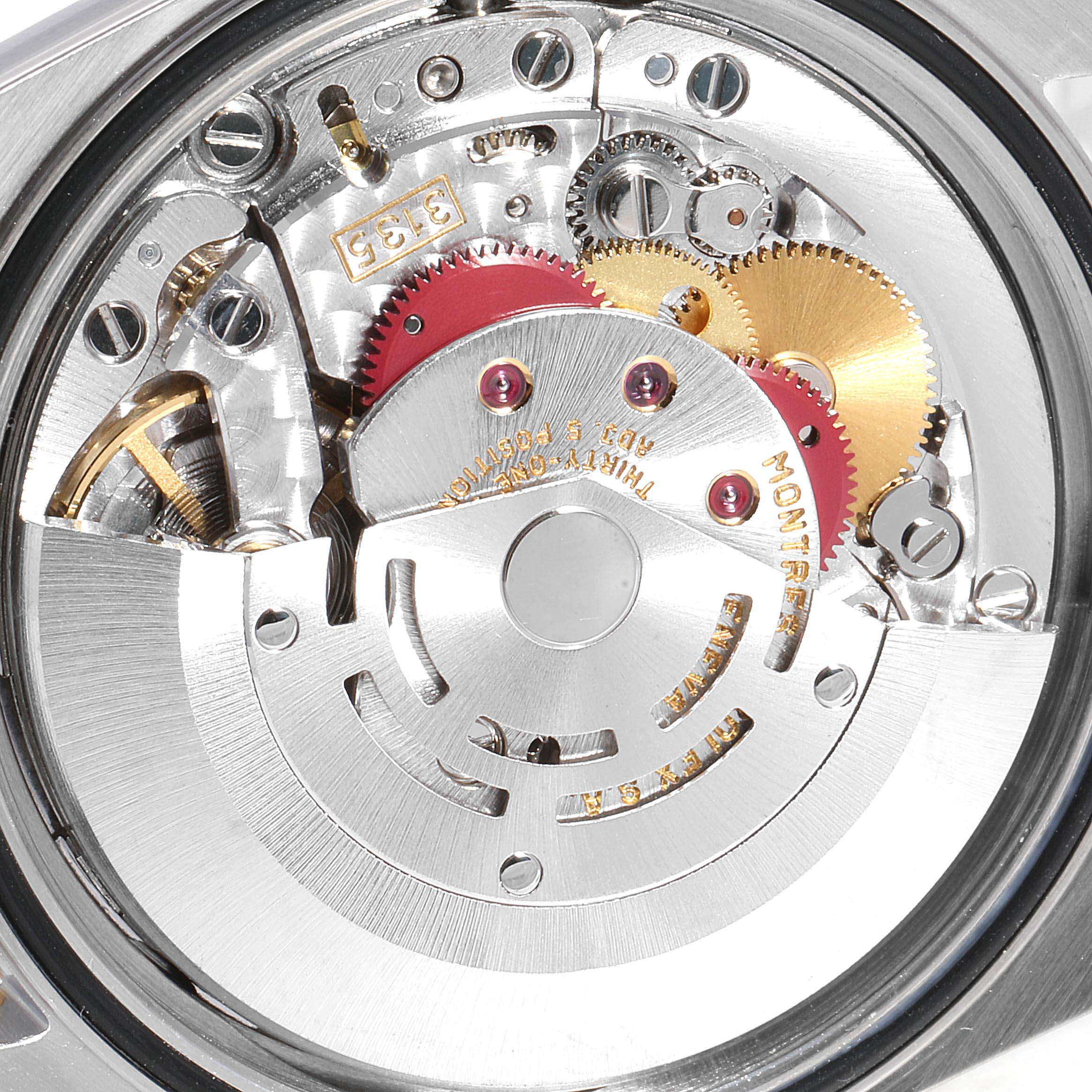 This image shows a close-up of the internal movement and components of a Rolex Datejust 16233 Men
s Steel and Gold (two tone) Champagne Dial 16233 Men
s Steel and Gold (two tone) Champagne Dial watch.