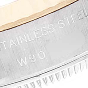 This image shows the side view of a stainless steel bezel of a Rolex Datejust 69173 Women
s Steel and Gold (two tone) Champagne Dial 69173 Women
s Steel and Gold (two tone) Champagne Dial watch, focusing on the model and material engravings.
