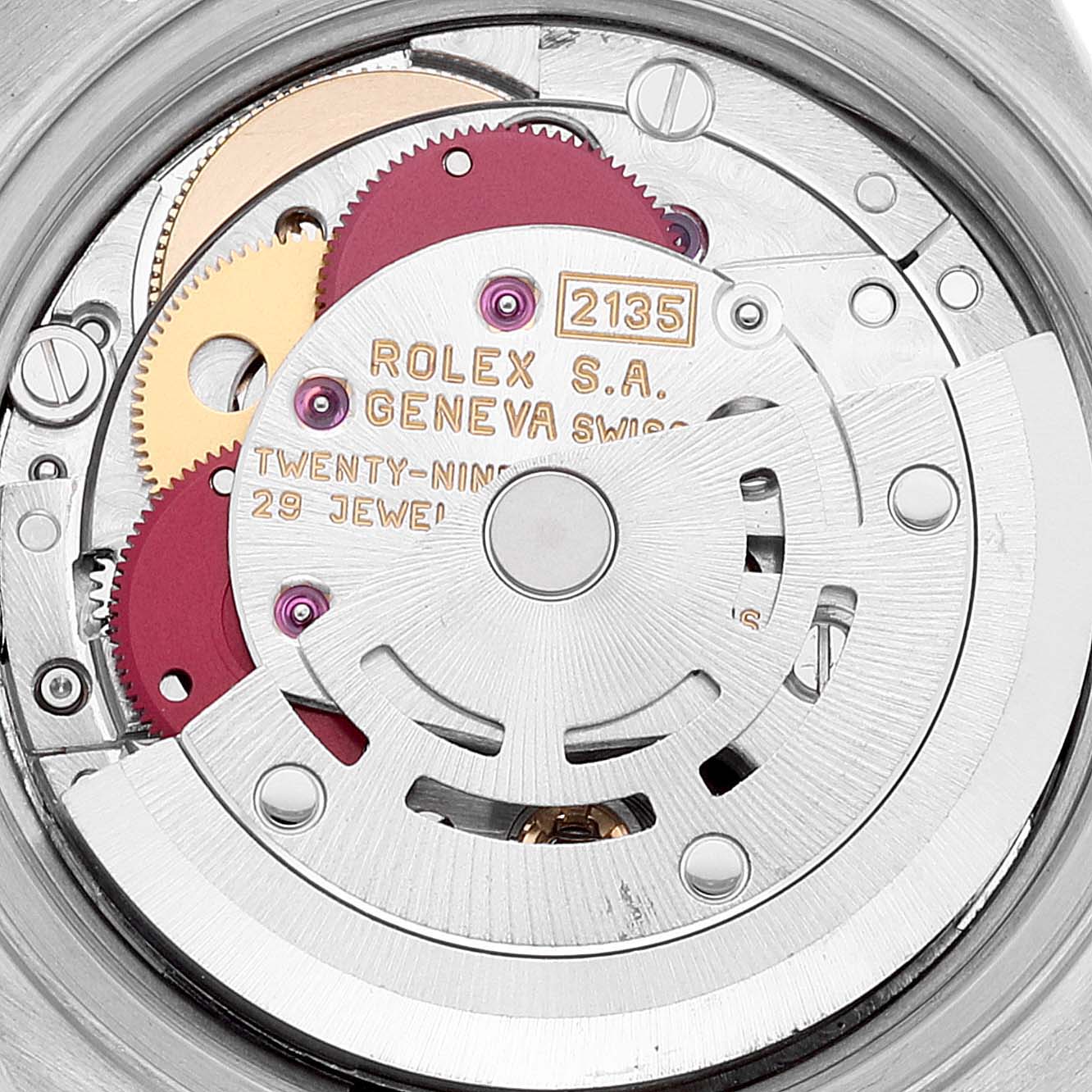 This image shows a close-up view of the movement inside a Rolex Datejust 69173 Women's Steel and Gold (two tone) Grey Dial 69173 Women's Steel and Gold (two tone) Grey Dial watch, featuring gears and inscriptions.