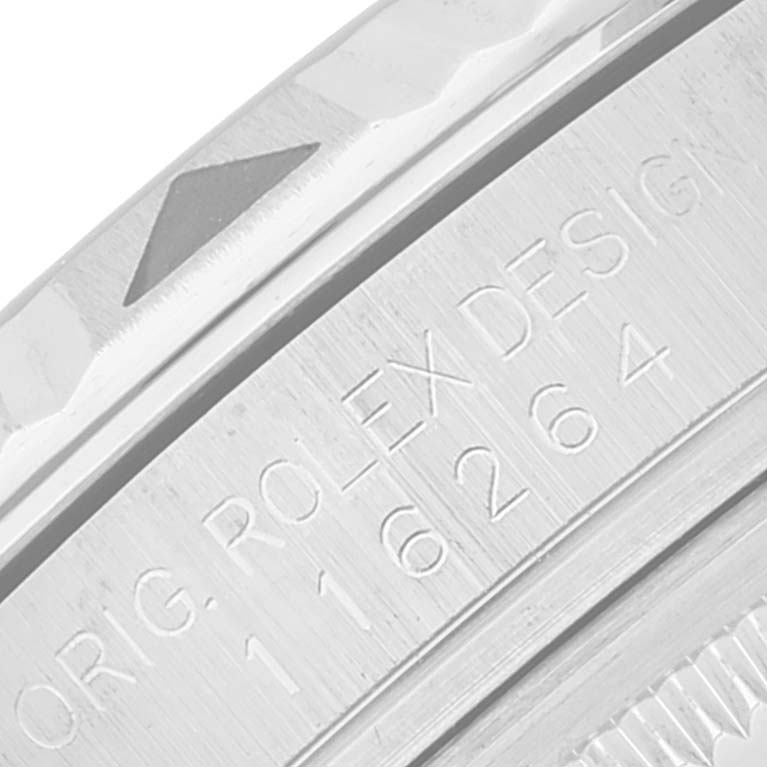 This close-up image shows the engraved bezel and part of the case of the Rolex Turn-o-Graph 116264 Men
s Stainless Steel White Dial 116264 Men
s Stainless Steel White Dial watch.