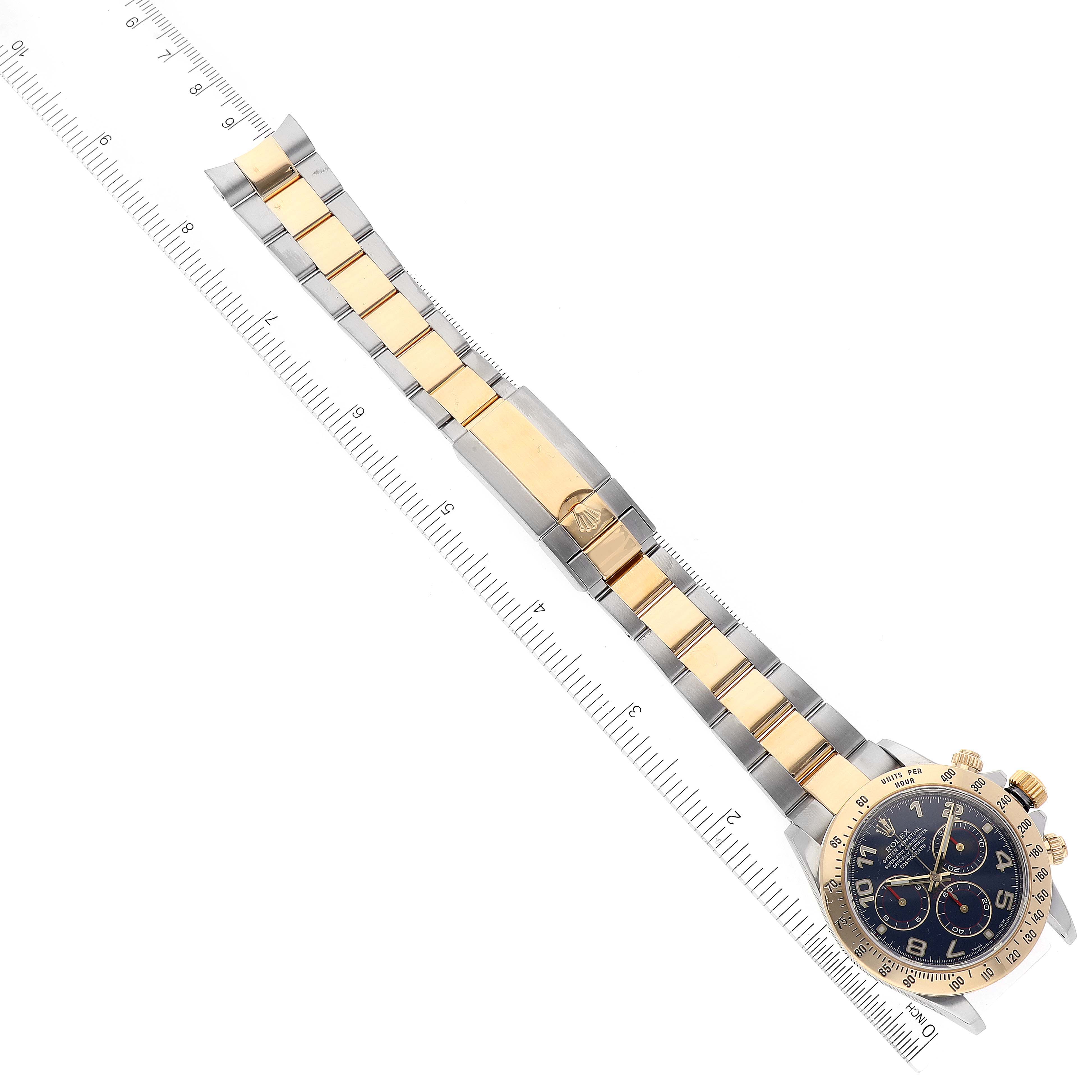 The image shows a top-down view of a Rolex Daytona 116523 Men's Steel and Gold (two tone) Blue Dial 116523 Men's Steel and Gold (two tone) Blue Dial watch, displaying the full bracelet, watch case, and dial.
