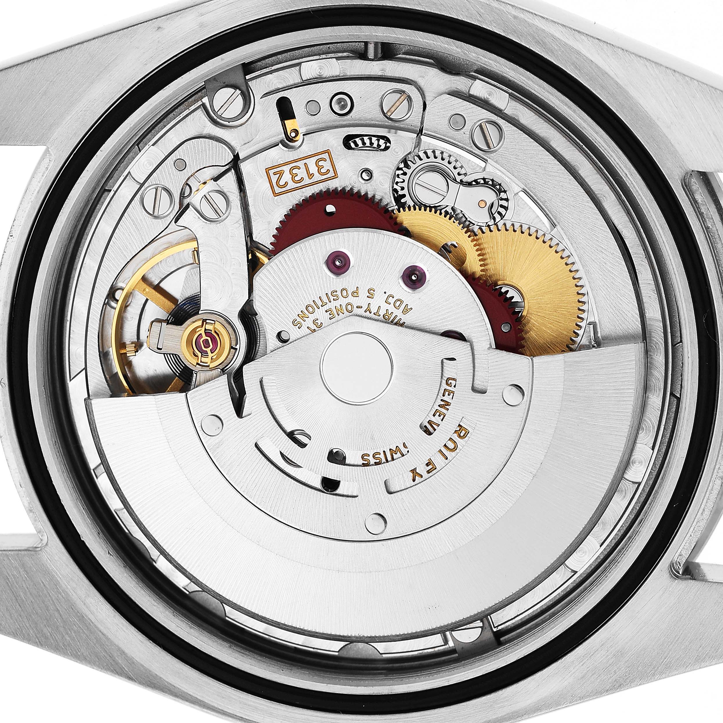 The image shows the movement of the Rolex Explorer M214270-0003 Men's Stainless Steel Black Dial watch from a top-down angle, highlighting the gears and rotor.