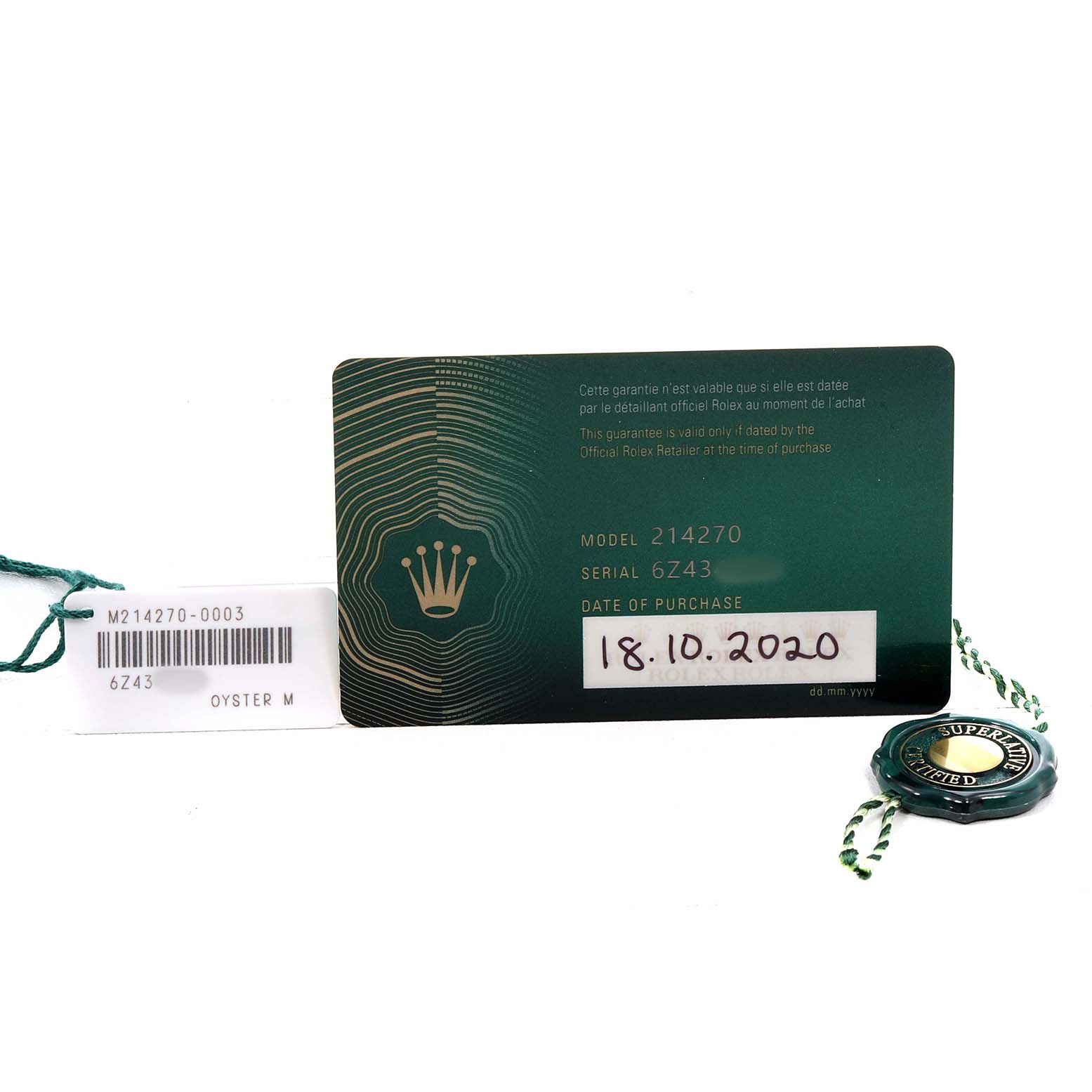 The image shows the warranty card, a tag, and a medallion for the Rolex Explorer M214270-0003 Men's Stainless Steel Black Dial, model 214270.