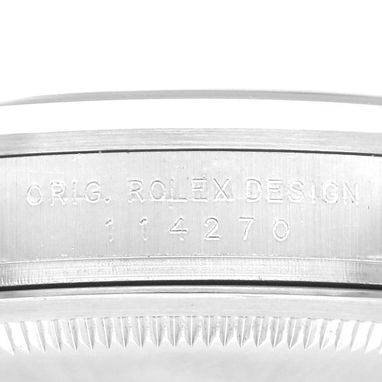 The image shows the side view of a Rolex Explorer 114270 Men's Stainless Steel Black Dial 114270 Men's Stainless Steel Black Dial model, highlighting the engraved case back with "ORIG. ROLEX DESIGN" and model number.