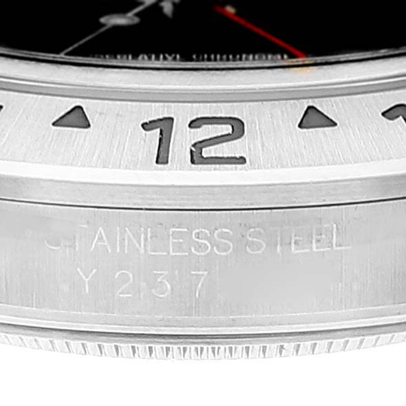 This image shows a close-up of the bezel and part of the case side of a Rolex Explorer 16570 Men's Stainless Steel Black Dial 16570 Men's Stainless Steel Black Dial watch.