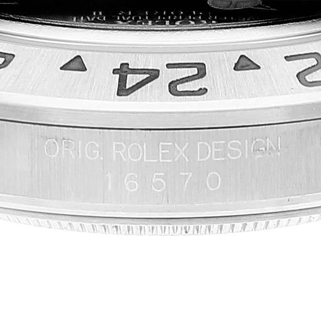 This image shows a close-up of the bezel and case side of a Rolex Explorer 16570 Men's Stainless Steel Black Dial 16570 Men's Stainless Steel Black Dial model, including the engraved model number.