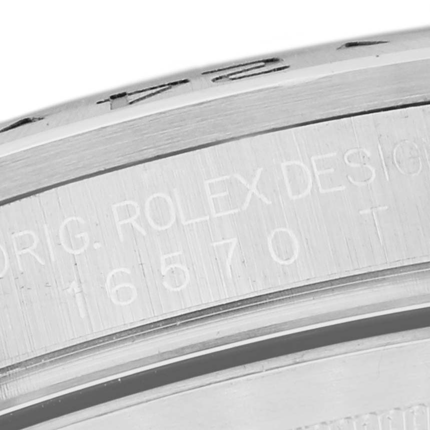 This image shows a close-up of the engraved case side of a Rolex Explorer 16570 Men
s Stainless Steel Black Dial 16570 Men
s Stainless Steel Black Dial, displaying the model number 16570.