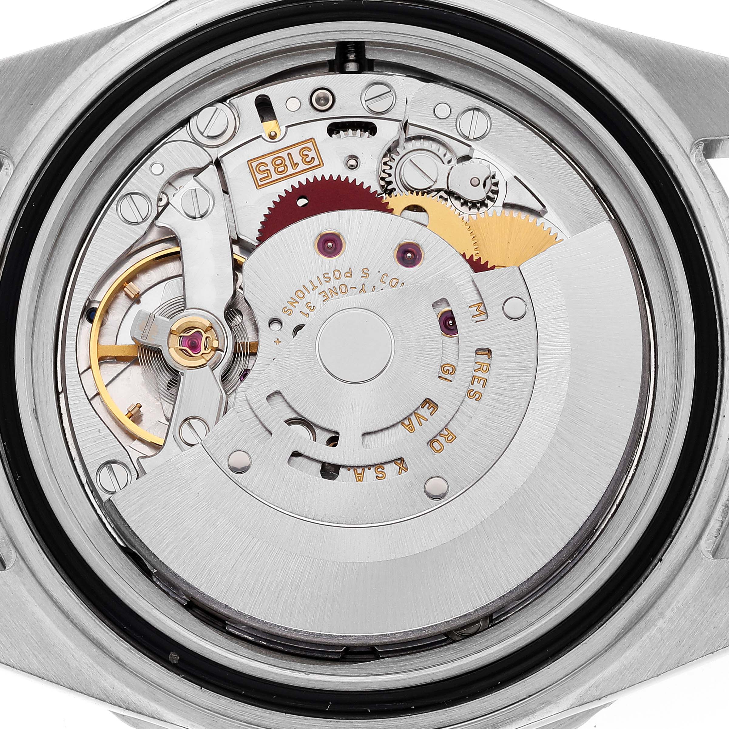 The image shows a close-up view of the movement inside a Rolex GMT-Master 16710 Men's Stainless Steel Black Dial 16710 Men's Stainless Steel Black Dial watch case, highlighting its intricate components and inner mechanics.