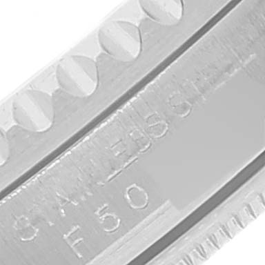 This close-up image shows the stainless steel bezel of a Rolex GMT-Master 16710 Men
s Stainless Steel Black Dial 16710 Men
s Stainless Steel Black Dial watch, highlighting its markings and grooved edge.