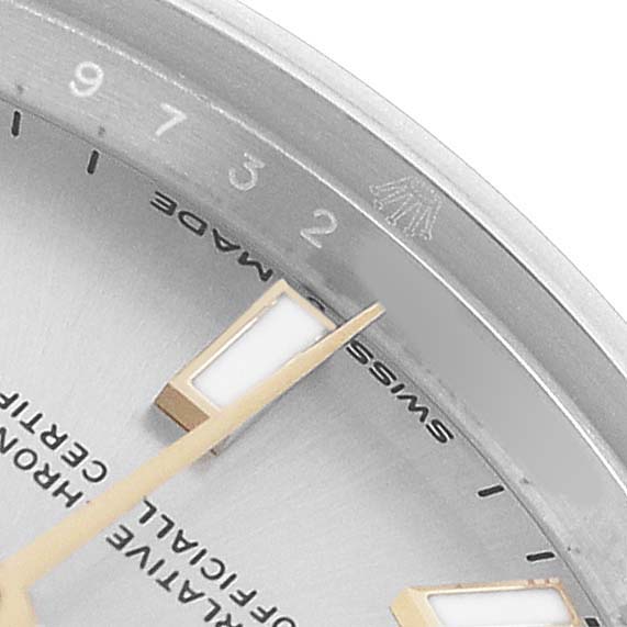 The image shows a close-up of the Rolex Mid-Size 277200 Women's Stainless Steel Silver Dial watch's dial, focusing on hour markers and part of the bezel.