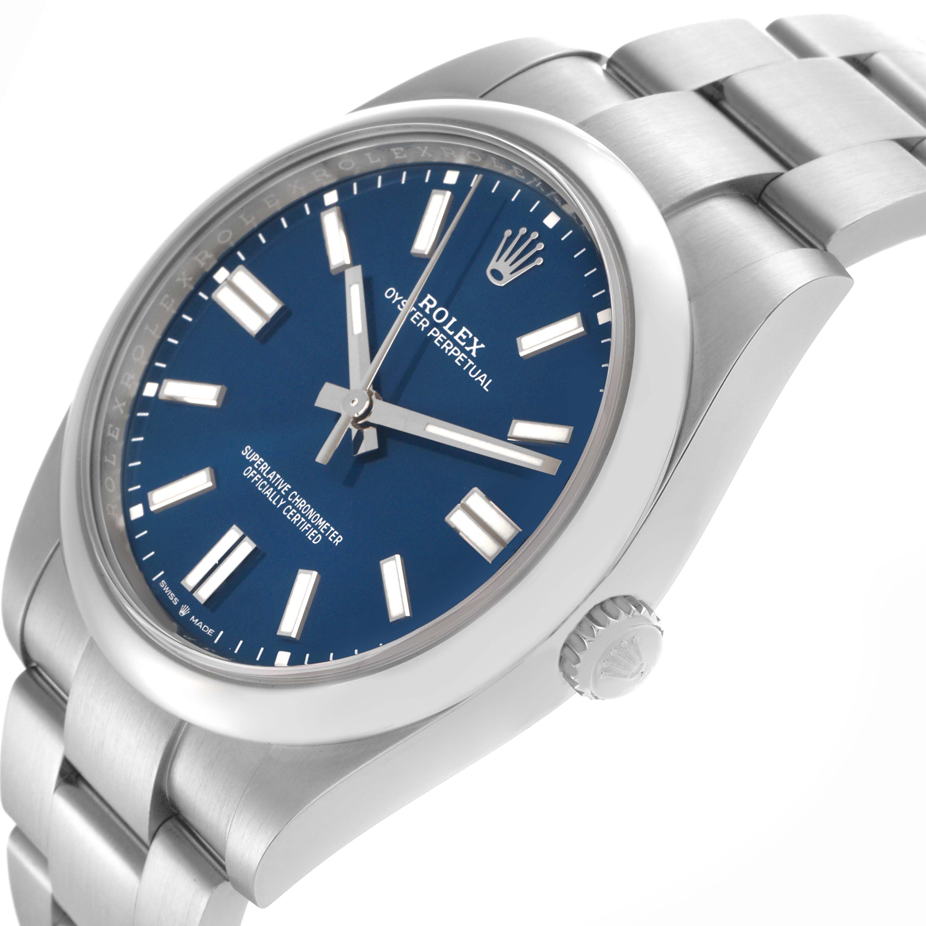 The Rolex Oyster Perpetual 124300 Men's Stainless Steel Blue Dial 124300 Men's Stainless Steel Blue Dial watch is shown from a side angle, highlighting the dial, crown, and bracelet.