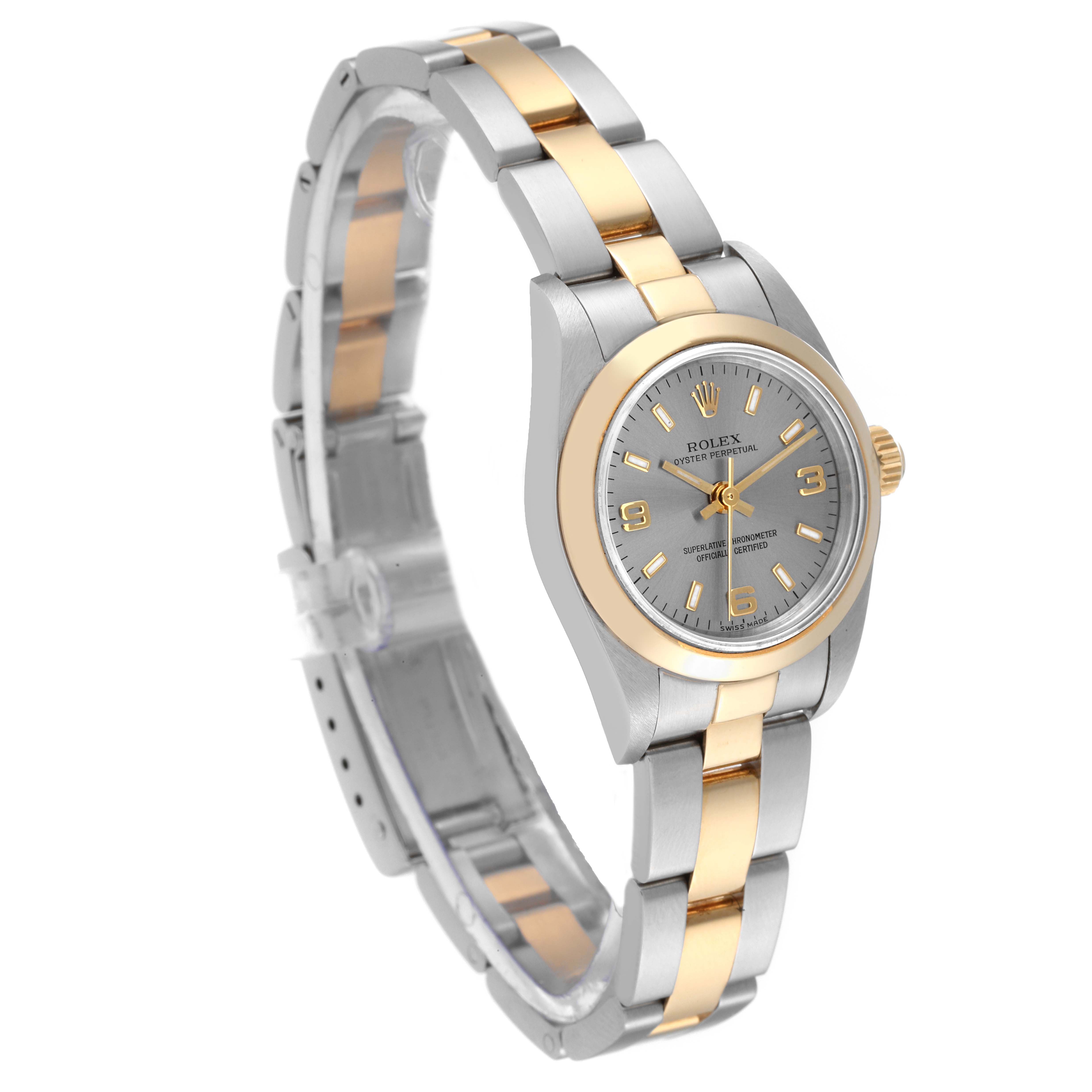 The image shows a Rolex Oyster Perpetual 76183 Women's Steel and Gold (two tone) Grey Dial 76183 Women's Steel and Gold (two tone) Grey Dial watch at a three-quarter angle, highlighting its two-tone bracelet and dial.