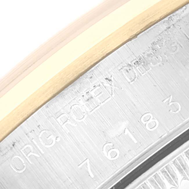 This image shows a close-up of the caseback edge of a Rolex Oyster Perpetual 76183 Women's Steel and Gold (two tone) Grey Dial 76183 Women's Steel and Gold (two tone) Grey Dial watch, highlighting the engraved text and reference numbers.