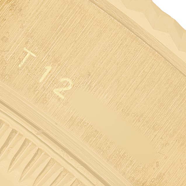 This image shows a close-up of the gold bezel with markings on a Rolex President 69178 Women's Yellow Gold Champagne Dial model watch.