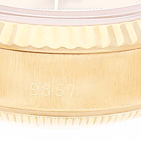 This image displays a close-up of the bezel and the side of a Rolex President 69178 Women
s Yellow Gold Champagne Dial 69178 Women
s Yellow Gold Champagne Dial model watch, showing the serial number engraved on the case.