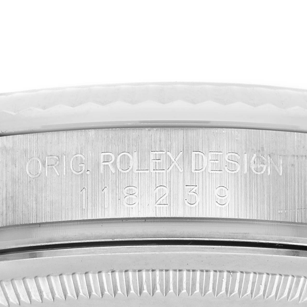 The image shows a close-up of the side of the Rolex President 118239A Men
s White Gold Silver Dial 118239A Men
s White Gold Silver Dial model, highlighting its engraved design and model number.