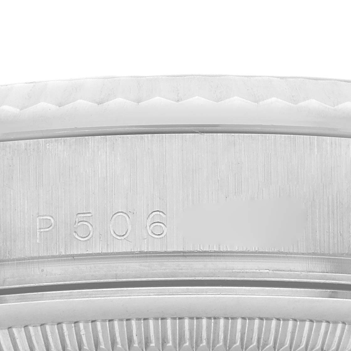 The image shows a close-up of the rehaut and part of the fluted bezel of a Rolex President 118239A Men
s White Gold Silver Dial 118239A Men
s White Gold Silver Dial model.