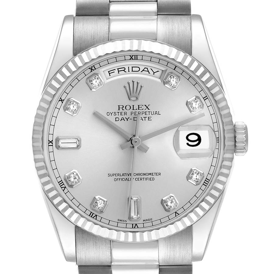 The image shows a frontal view of the Rolex President model, highlighting its silver dial, diamond hour markers, and fluted bezel.