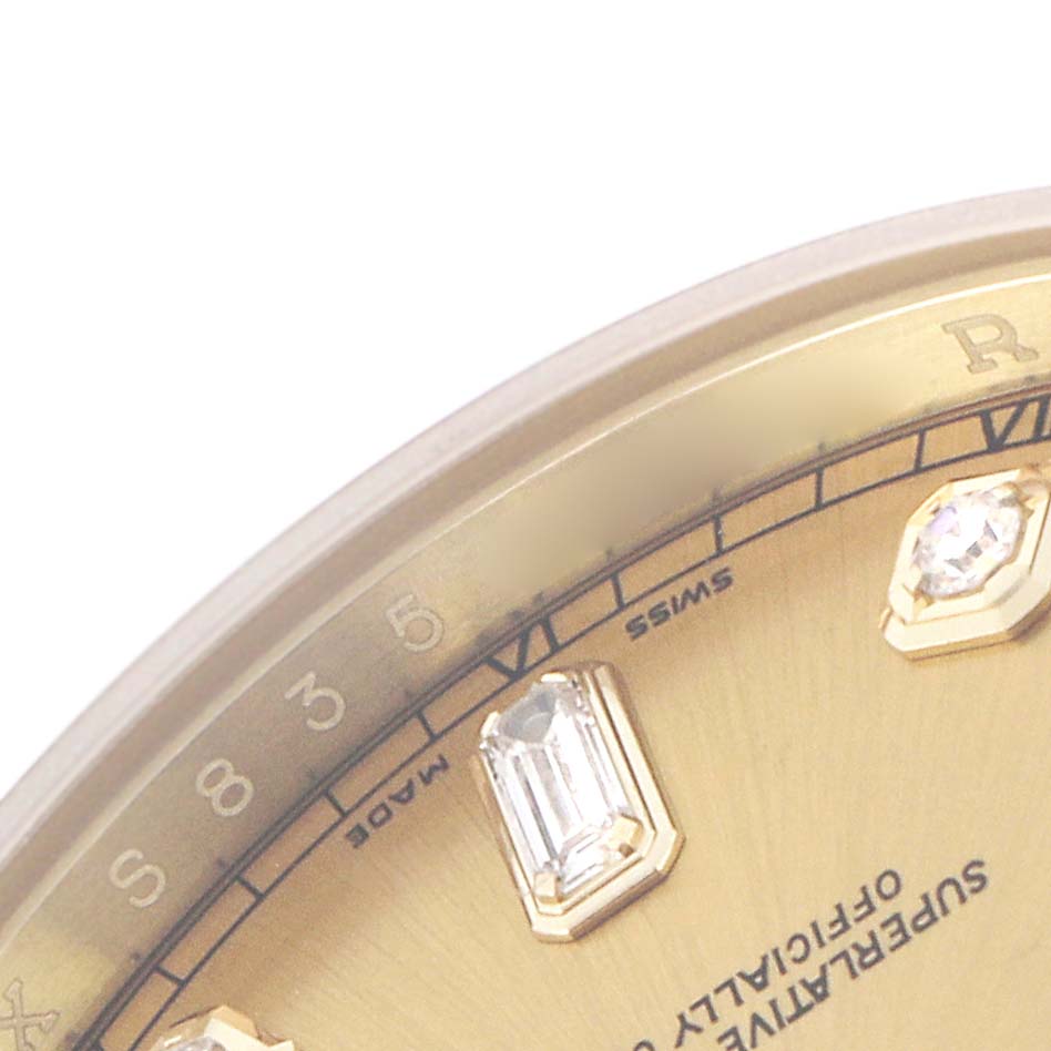 The image shows a close-up of the diamond markers on the dial of a Rolex President 118238 Men's Yellow Gold Champagne Dial 118238 Men's Yellow Gold Champagne Dial watch, with part of the bezel visible.
