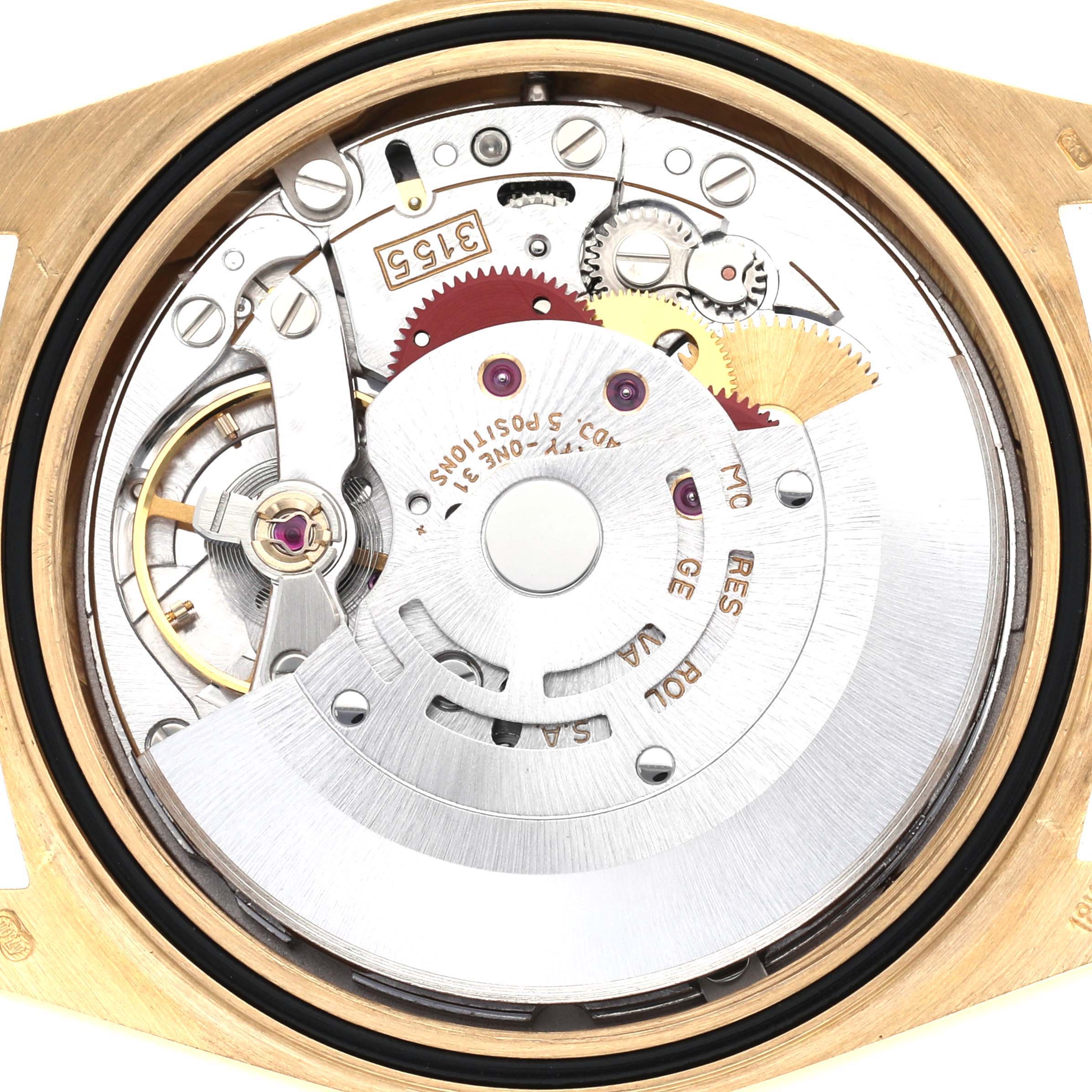 The image shows the movement mechanism of a Rolex President 18238 Men
s Yellow Gold Champagne Dial 18238 Men
s Yellow Gold Champagne Dial watch, viewed from the back, highlighting gears and precision components.