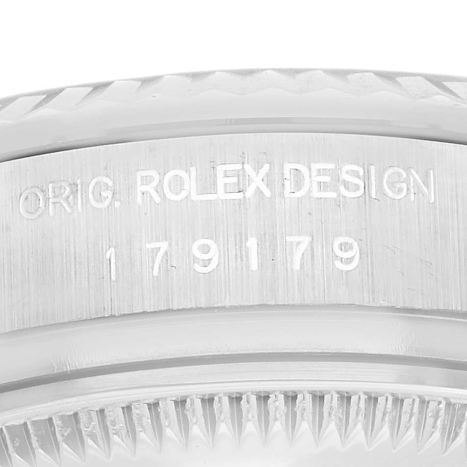 The image shows a close-up of the side of a Rolex President 179179 Women's White Gold Silver Dial 179179 Women's White Gold Silver Dial model, highlighting the engraving details.