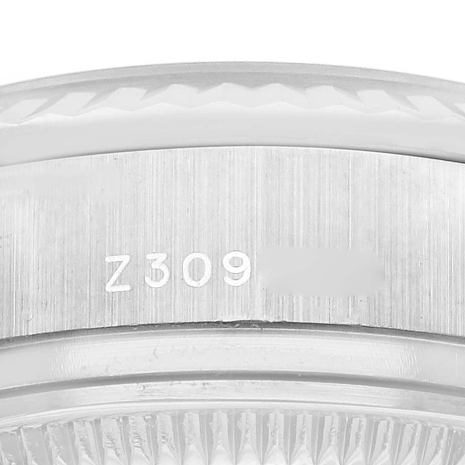 The image shows a close-up of the bezel and case side of a Rolex President 179179 Women's White Gold Silver Dial 179179 Women's White Gold Silver Dial model, focusing on engraved markings.