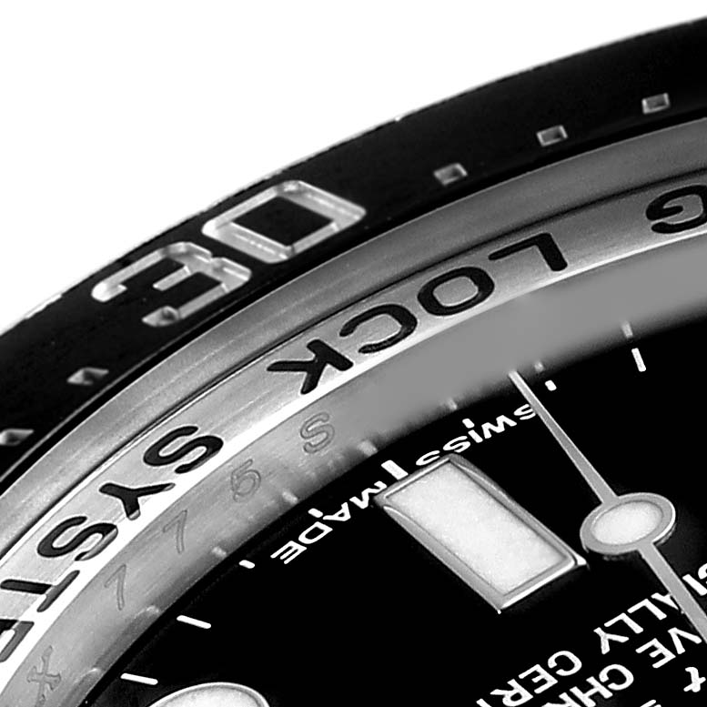 The image shows a close-up of the bezel and part of the dial of the Rolex Sea-Dweller 116660 Men's Stainless Steel Black Dial 116660 Men's Stainless Steel Black Dial watch.