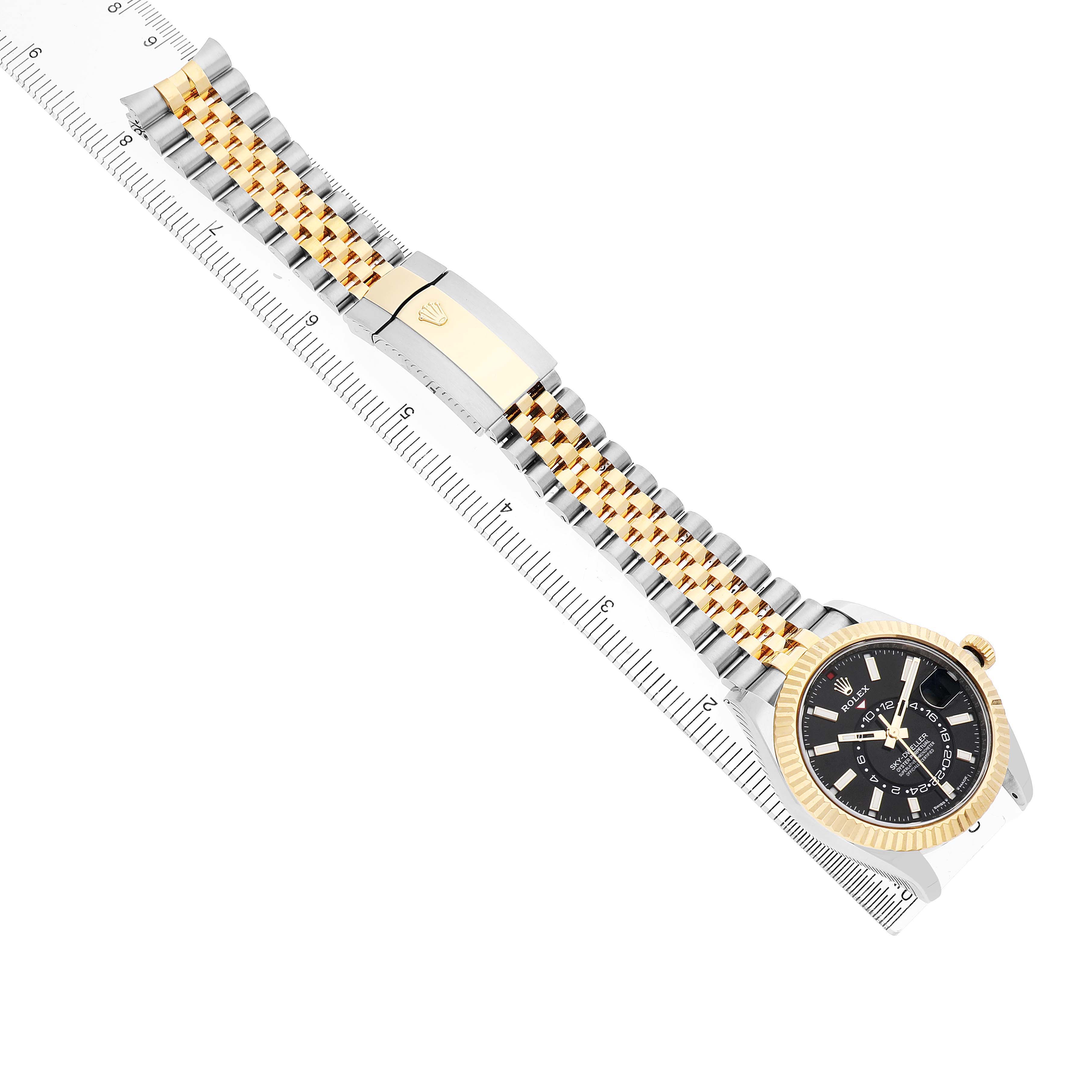 The Rolex Sky-Dweller 336933 Men's Steel and Gold (two tone) Black Dial is shown at an angled top view, displaying the watch face and metal bracelet with a two-tone finish.