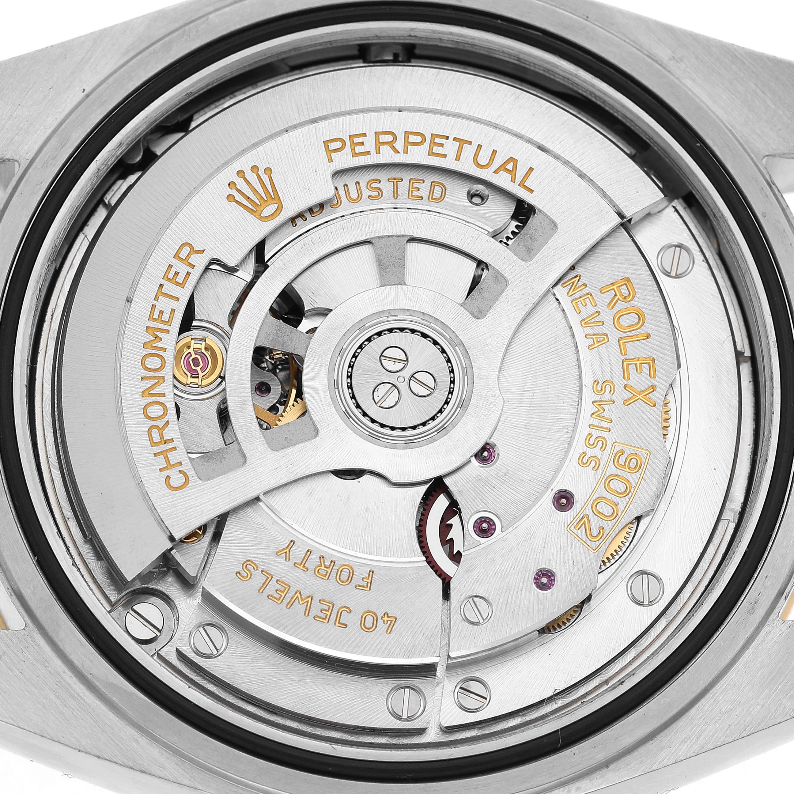 The image shows the movement mechanism of the Rolex Sky-Dweller 336933 Men's Steel and Gold (two tone) Black Dial, including the rotor and inscriptions at a top-down angle.