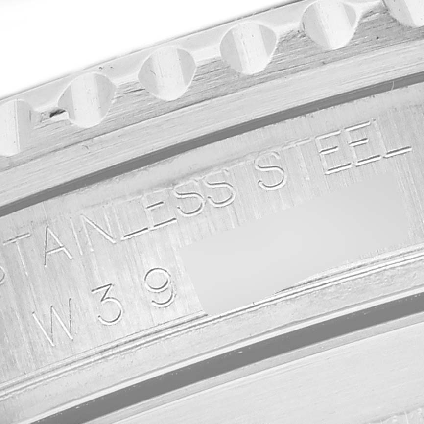 The image shows an angled close-up of the inner bezel and engraved text on a Rolex Submariner 16610 Men
s Stainless Steel Black Dial 16610 Men
s Stainless Steel Black Dial watch.