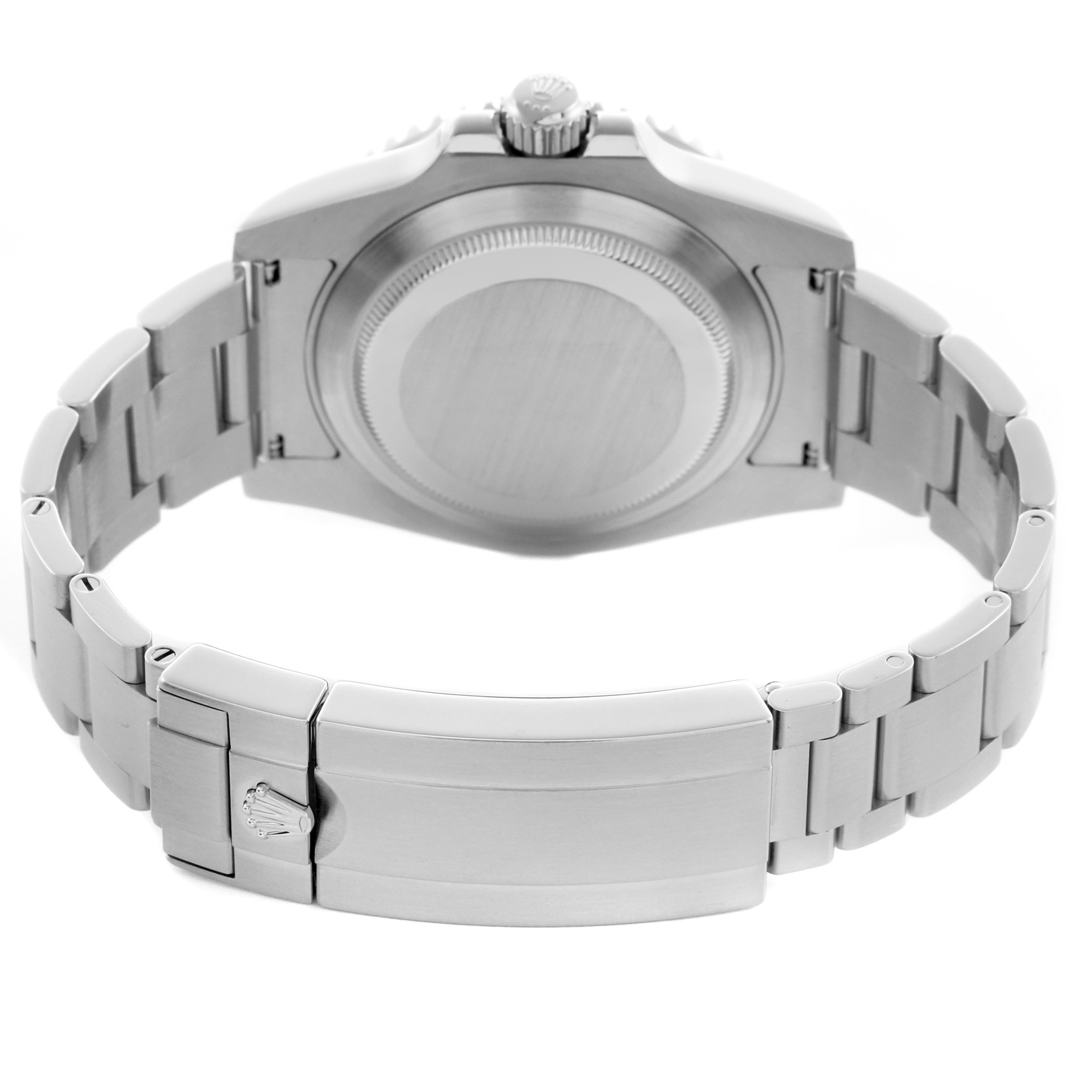 The Rolex Submariner 114060 Men's Stainless Steel Black Dial 114060 Men's Stainless Steel Black Dial watch is shown from the back, highlighting the case back and metal bracelet with clasp.