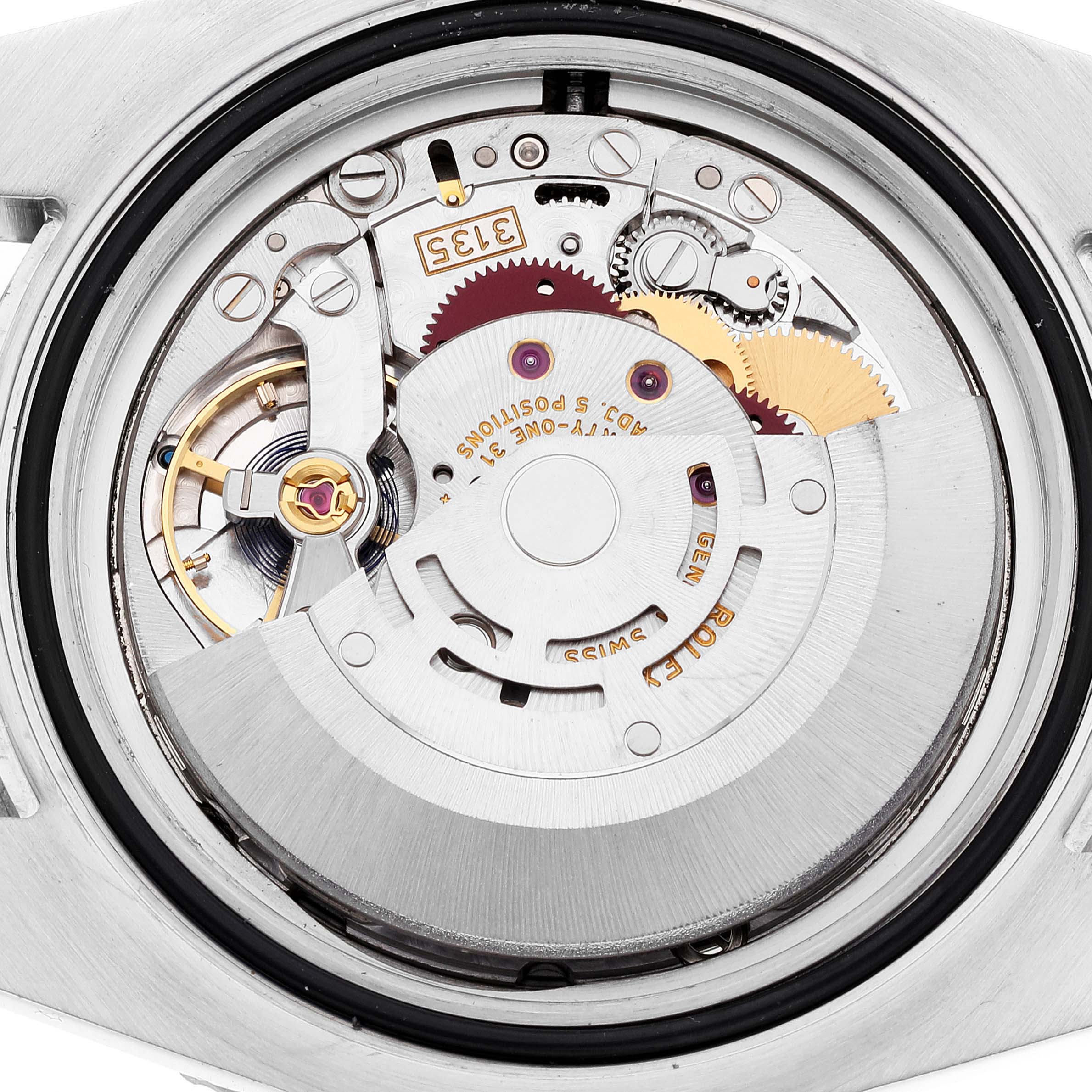 This image shows the inner mechanical workings and movement components of the Rolex Submariner 116613 Men's Steel and Gold (two tone) Blue Dial 116613 Men's Steel and Gold (two tone) Blue Dial watch from a rear angle, without the caseback.