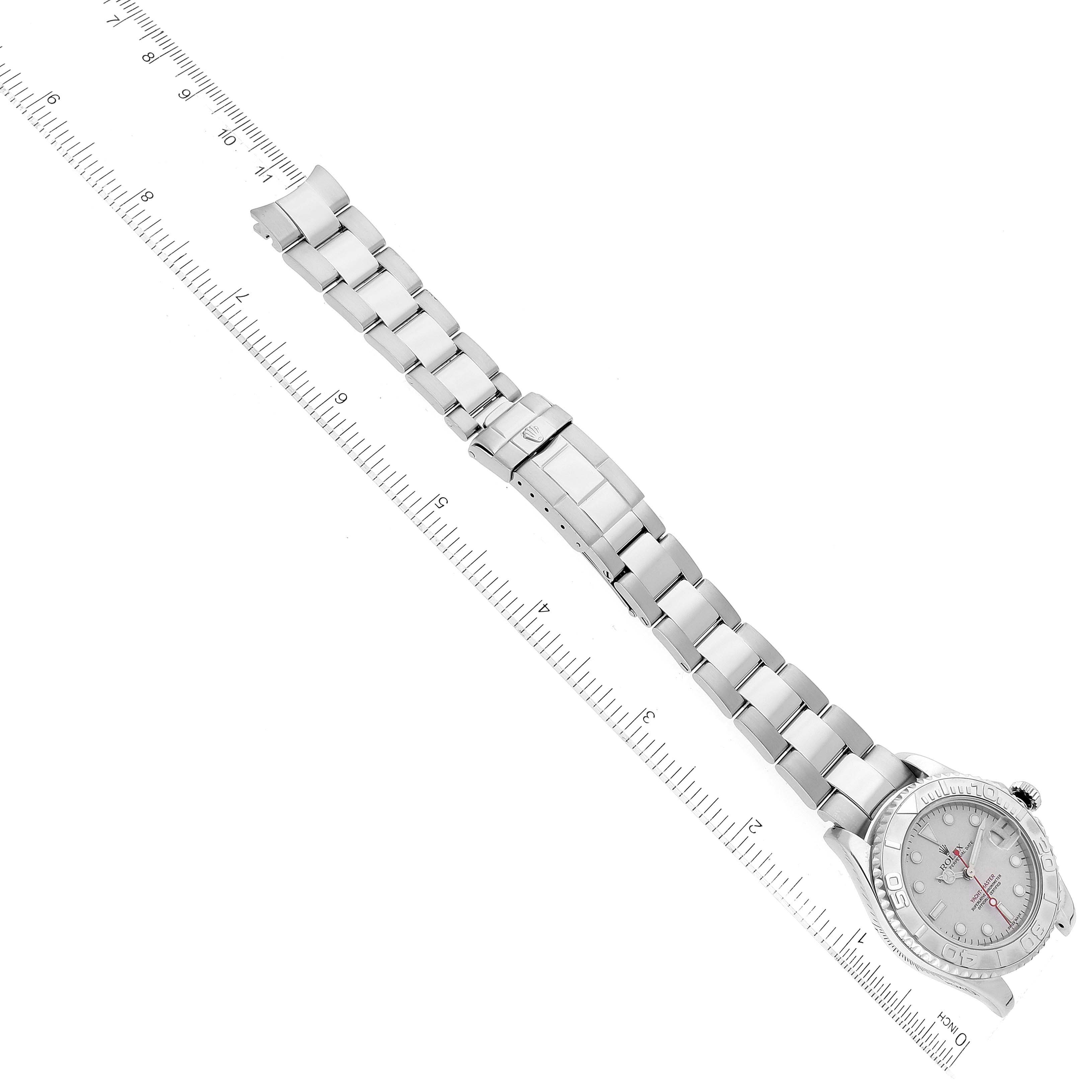 The image shows the Yacht-Master watch by Rolex from a top-down angle, displaying the bracelet, watch case, and clasp.