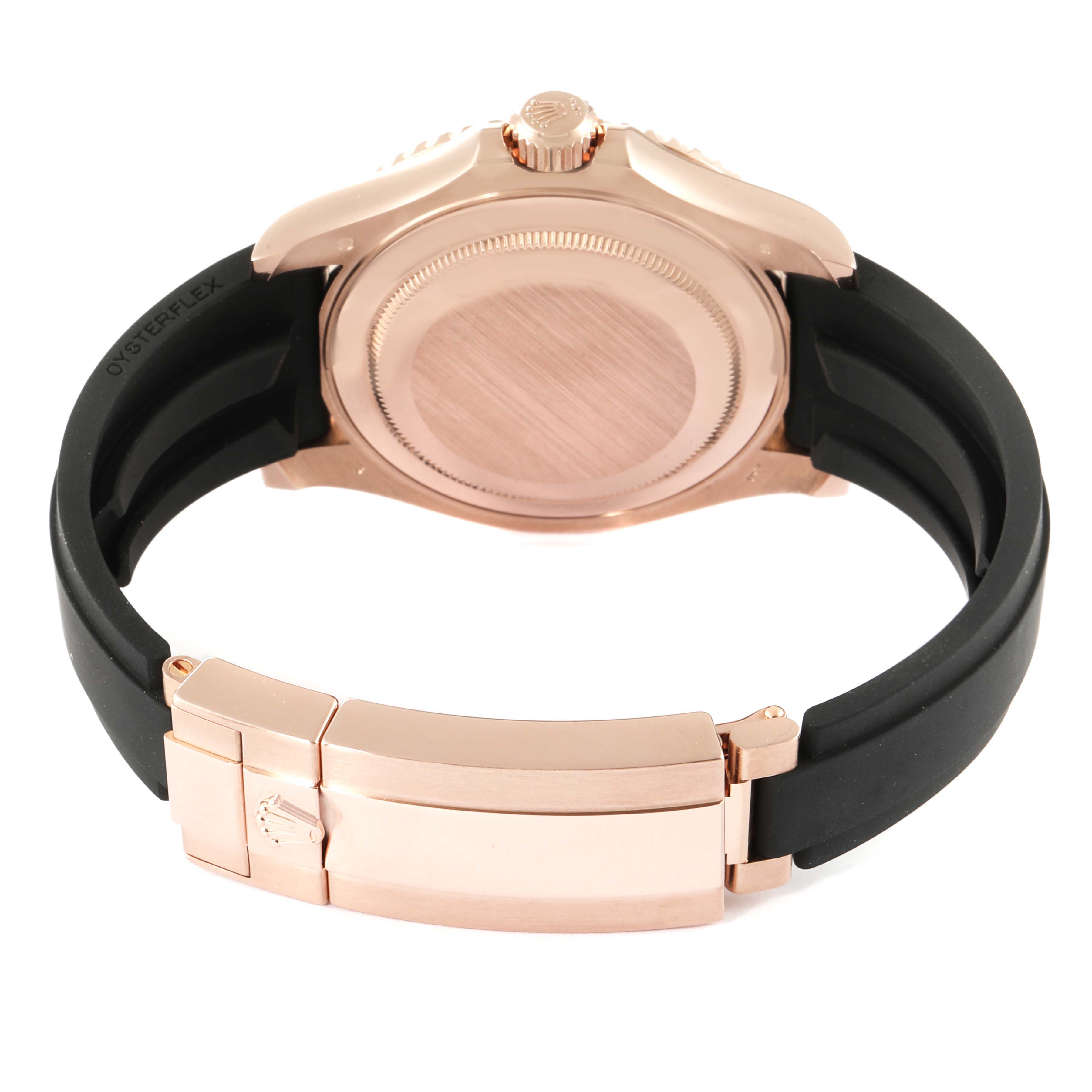 This Yacht-Master Rolex watch is shown from the back, highlighting the case back, crown, and clasp on the black rubber strap.