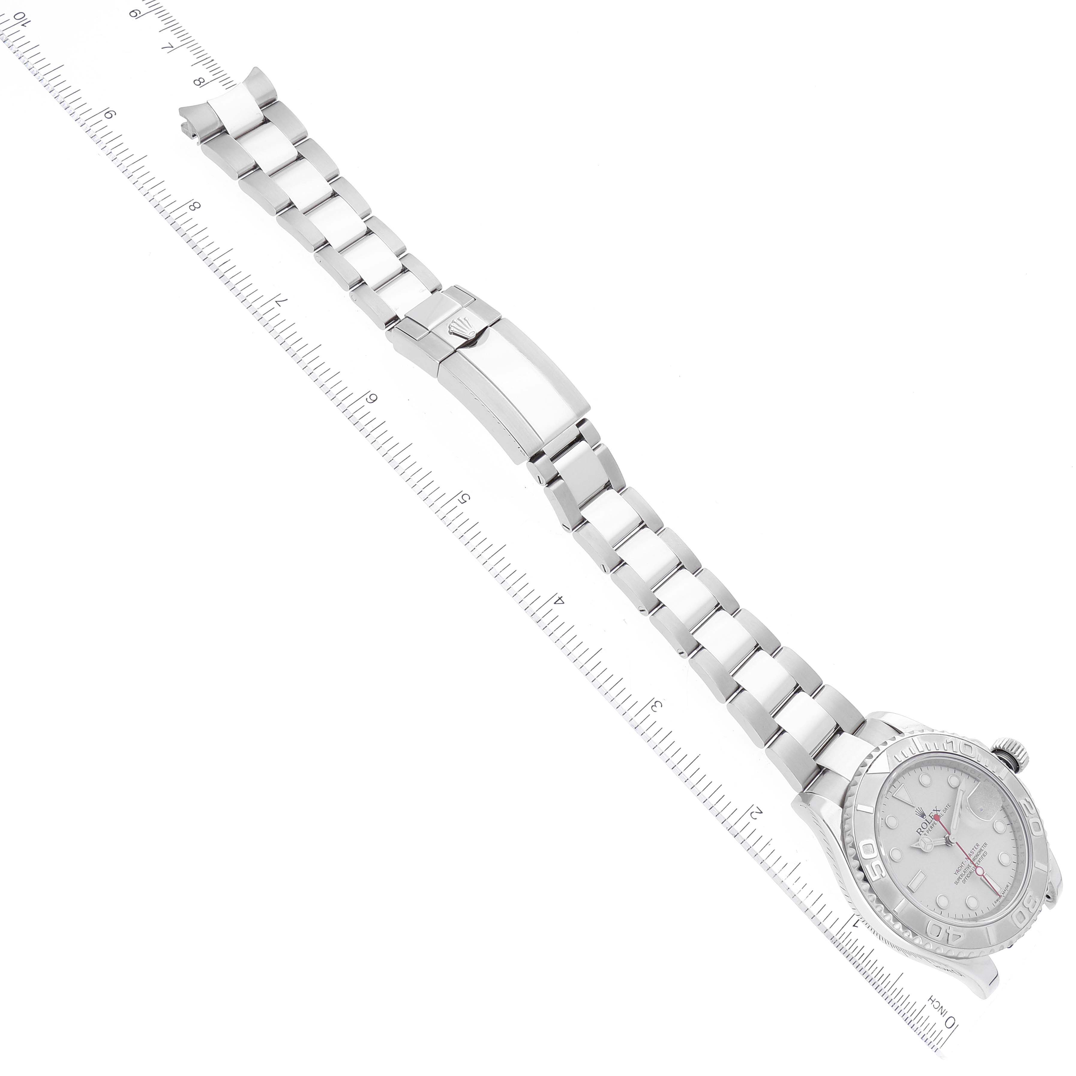 The image shows the Rolex Yacht-Master 116622 Men's Stainless Steel Silver Dial 116622 Men's Stainless Steel Silver Dial watch laid flat with its bracelet extended and a ruler for scale.