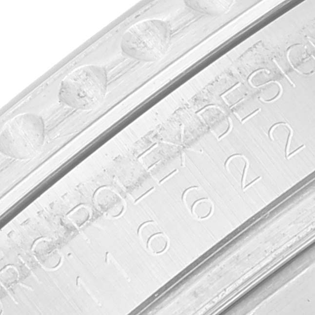 This is a close-up view of the bezel and inner rim of the Rolex Yacht-Master 116622 Men's Stainless Steel Silver Dial 116622 Men's Stainless Steel Silver Dial watch showing etched details and part of the design number.