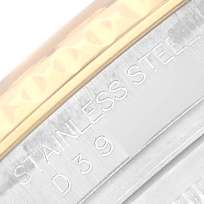 The image shows a close-up of the side of a Rolex Yacht-Master 16623 Men's Steel and Gold (two tone) Champagne Dial 16623 Men's Steel and Gold (two tone) Champagne Dial watch, highlighting the stainless steel engraving and part of the two-tone bezel.