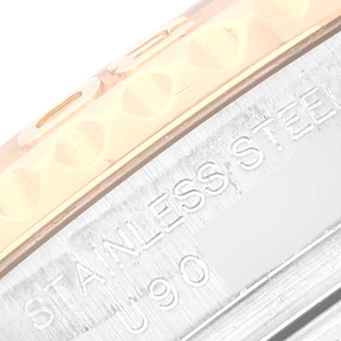 Close-up of the bezel and case of a Rolex Yacht-Master 69623 Women's Steel and Gold (two tone) Grey Dial 69623 Women's Steel and Gold (two tone) Grey Dial, showing a two-tone design and engraved text.