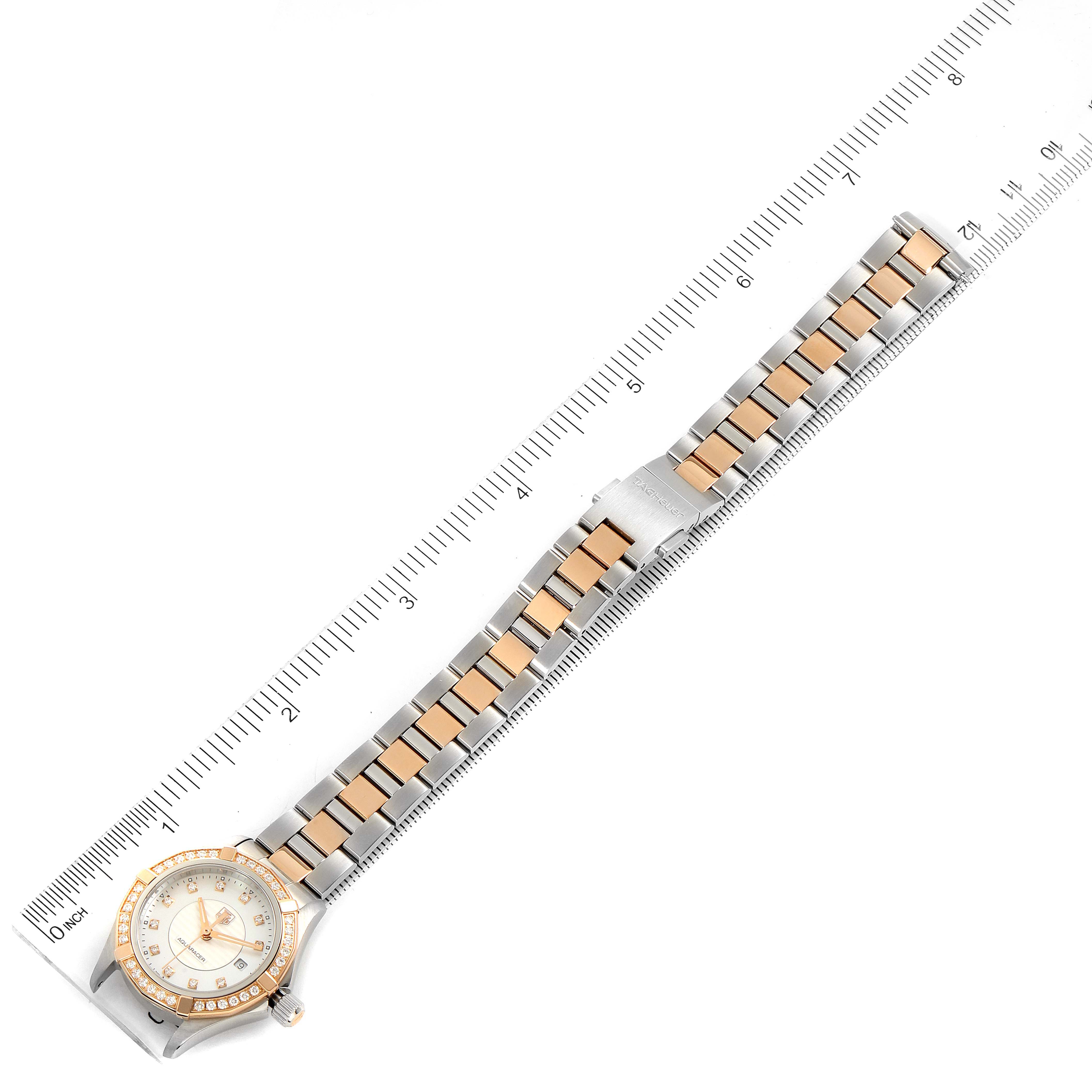 The image shows a top-down view of a Tag Heuer Aquaracer WAP1452.BD0837 Women
s Steel and Gold (two tone) Mother of Pearl Dial WAP1452.BD0837 Women
s Steel and Gold (two tone) Mother of Pearl Dial watch, focusing on the full watch, including its bezel, face, and two-tone bracelet.