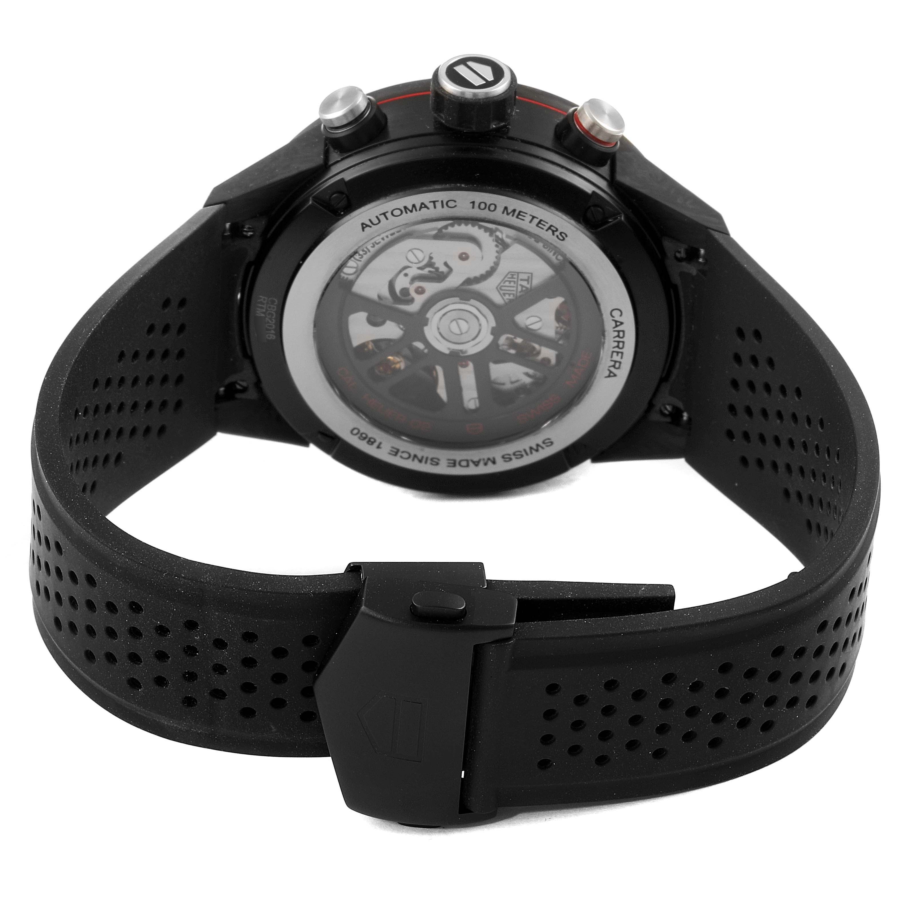 The image shows the back view of a Tag Heuer Carrera CBG2016.FT6143 Men's Stainless Steel Black Dial CBG2016.FT6143 Men's Stainless Steel Black Dial model watch, featuring its automatic movement and black perforated rubber strap.