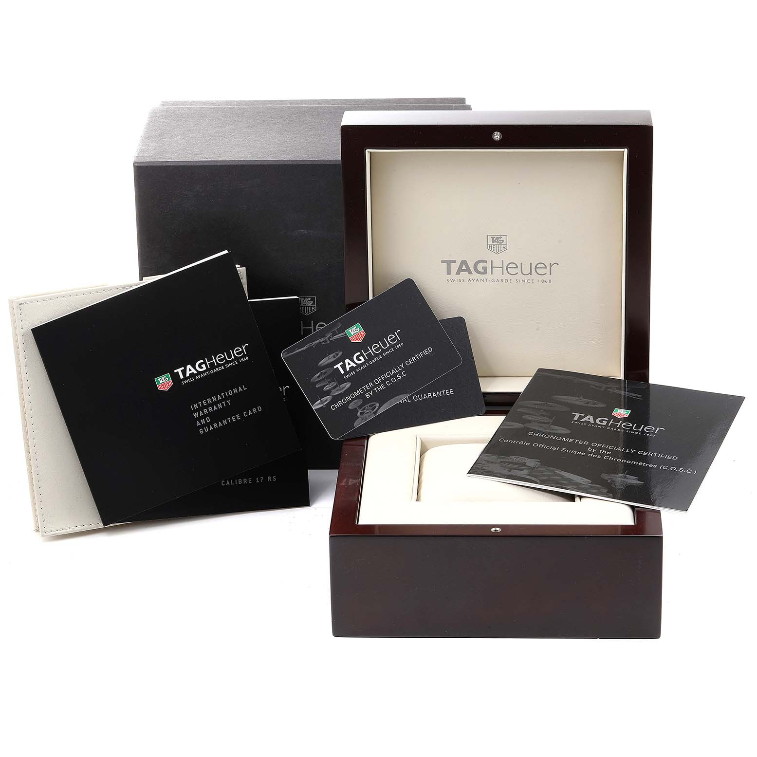 The image shows packaging and accessories, including the box, manuals, and guarantee cards for a Tag Heuer Carrera CAV511C Men's Stainless Steel Black Dial CAV511C Men's Stainless Steel Black Dial watch.