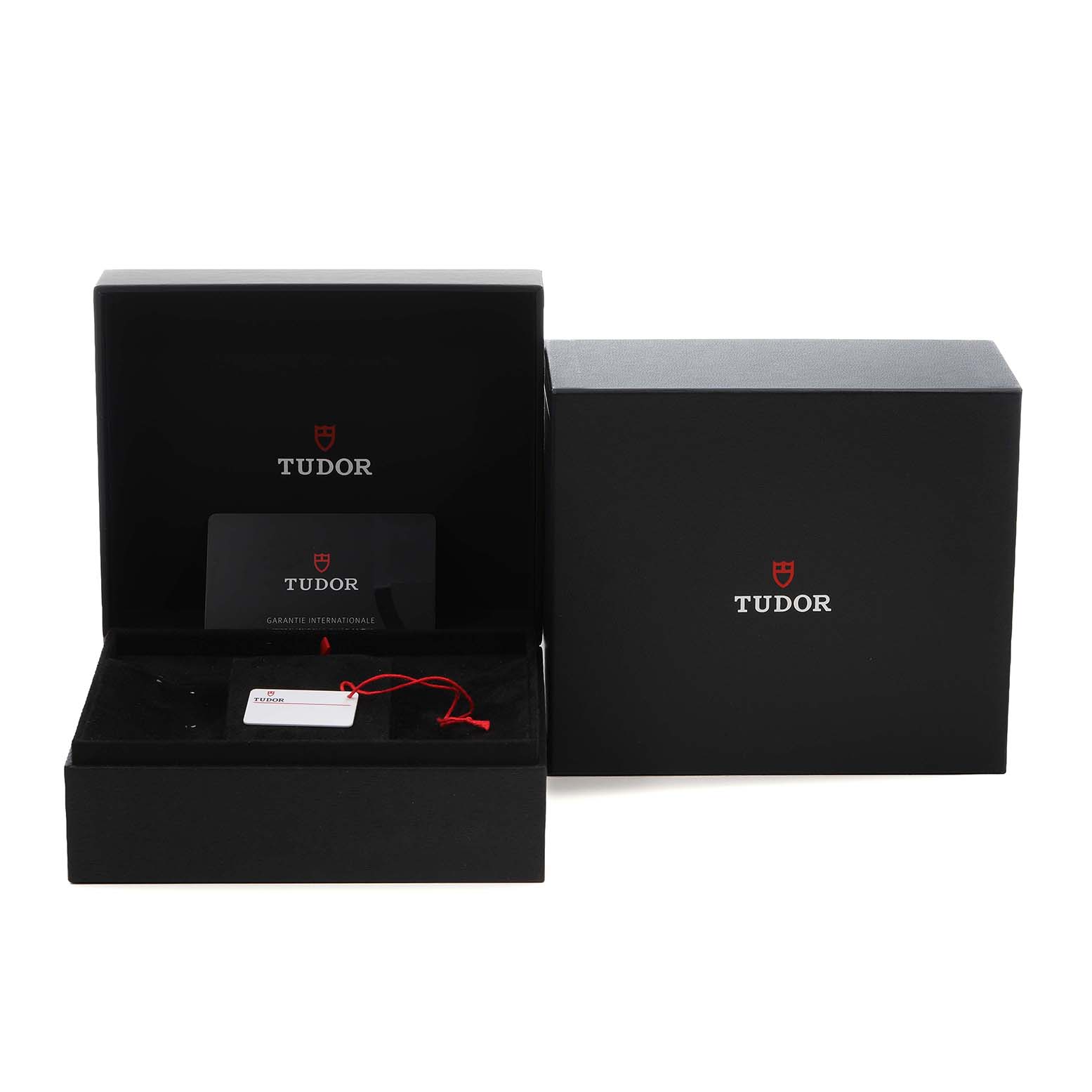 The image shows the Tudor Heritage Black Bay M79030N-0001 Men's Stainless Steel Black Dial watch box, open to reveal a warranty card and tag inside.