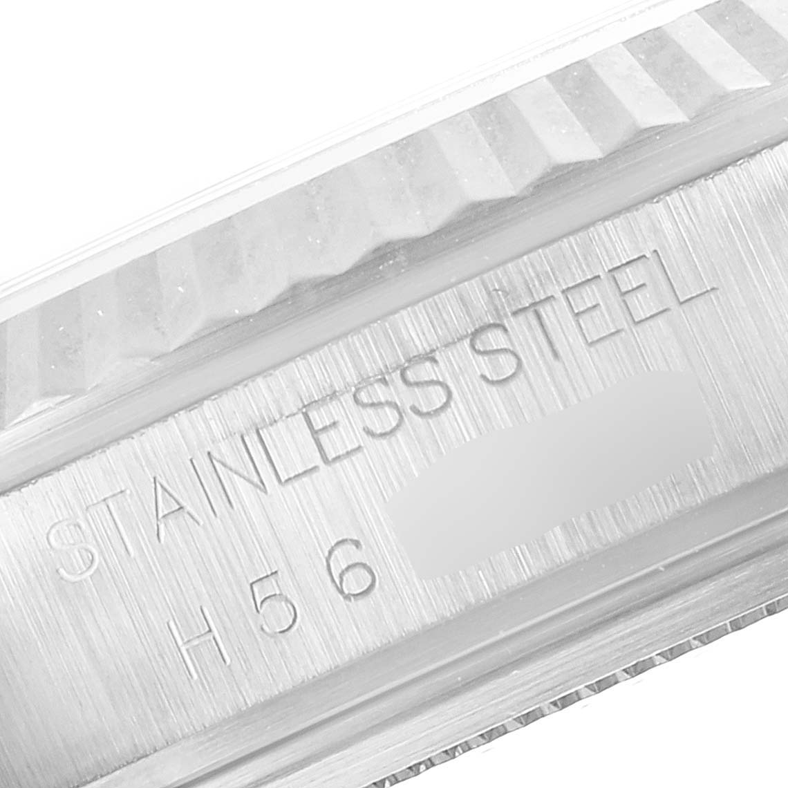 The image shows a close-up of the stainless steel case back and ridged edge of a Tudor Prince 76214 Men
s Stainless Steel Black Dial 76214 Men
s Stainless Steel Black Dial model watch.