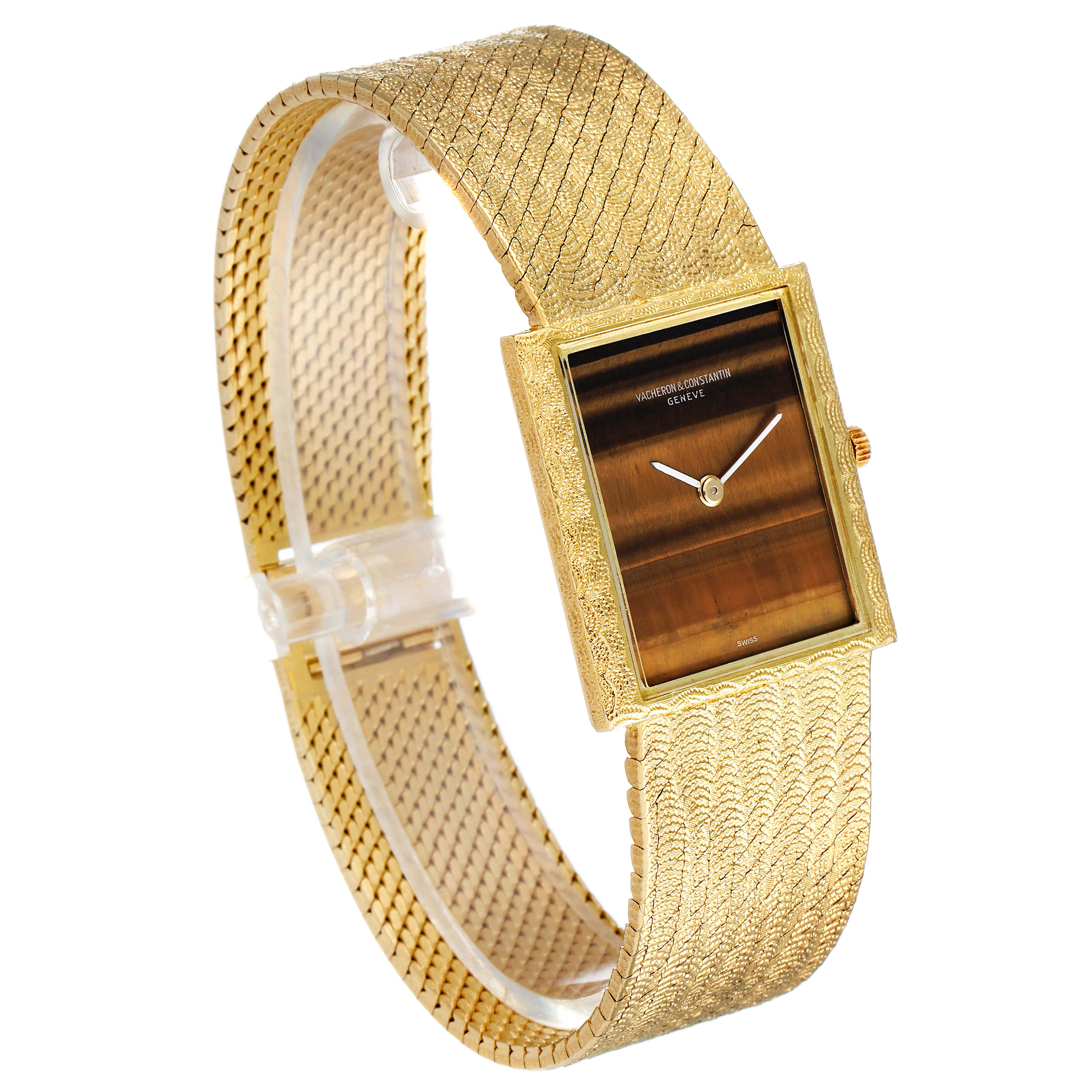 This image shows a side view of a Vintage Vacheron Constantin watch featuring its textured gold bracelet and rectangular dial.