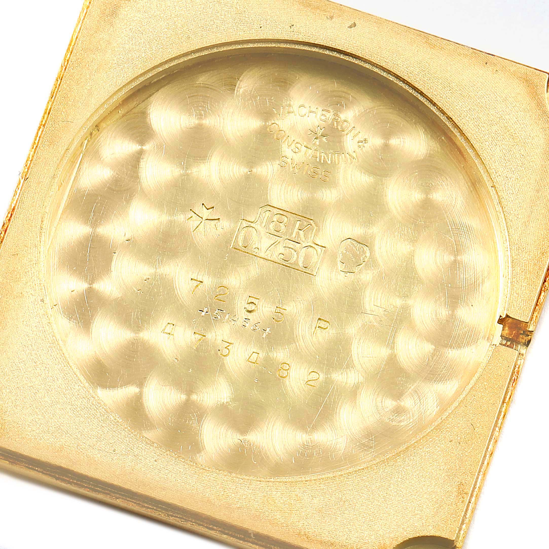 This image shows the interior of the case back for the Vintage Vacheron Constantin watch, marked "18K 0.750" and other identifiers.