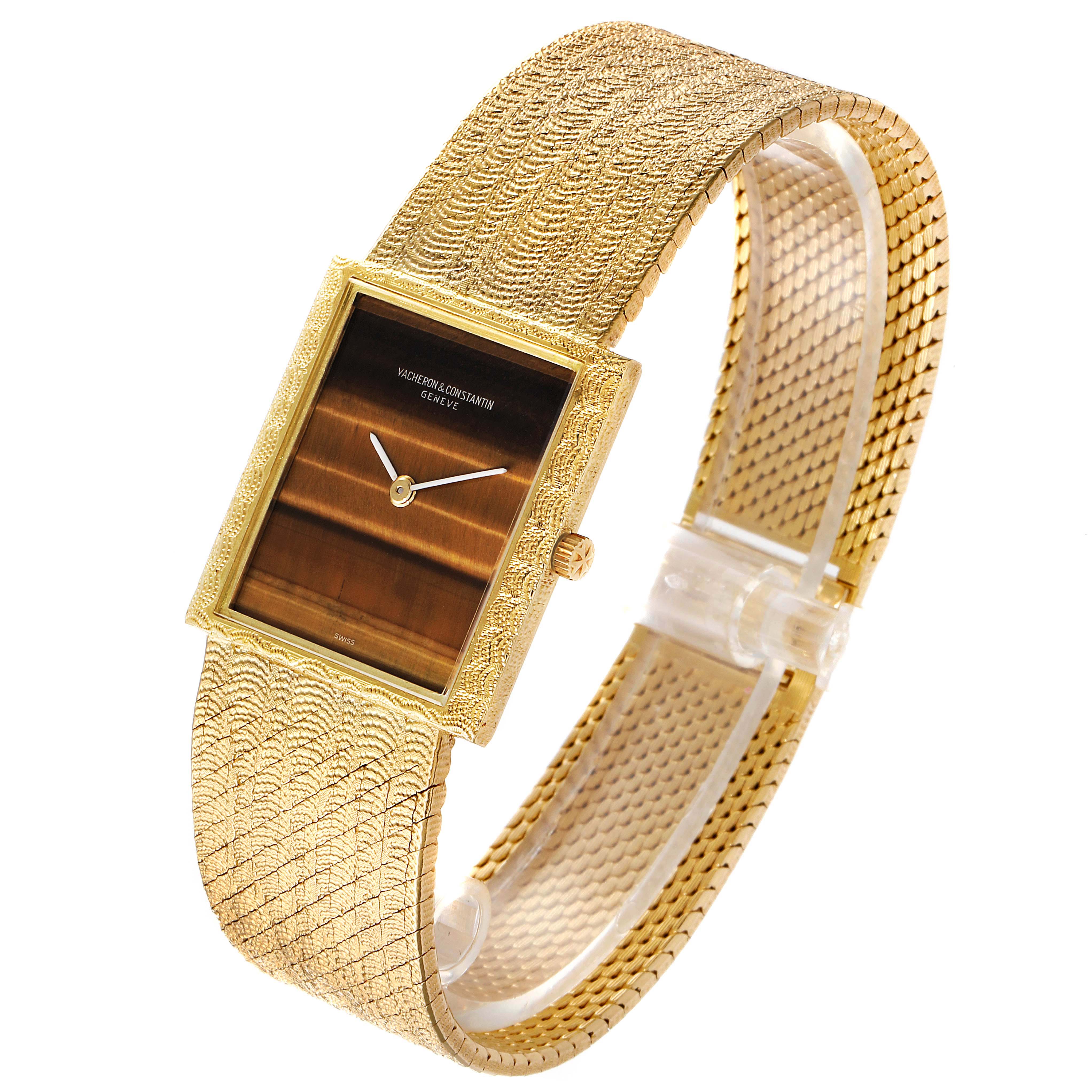 This image shows a side-angled view of the Vintage Vacheron Constantin watch, highlighting its textured gold band and rectangular face.