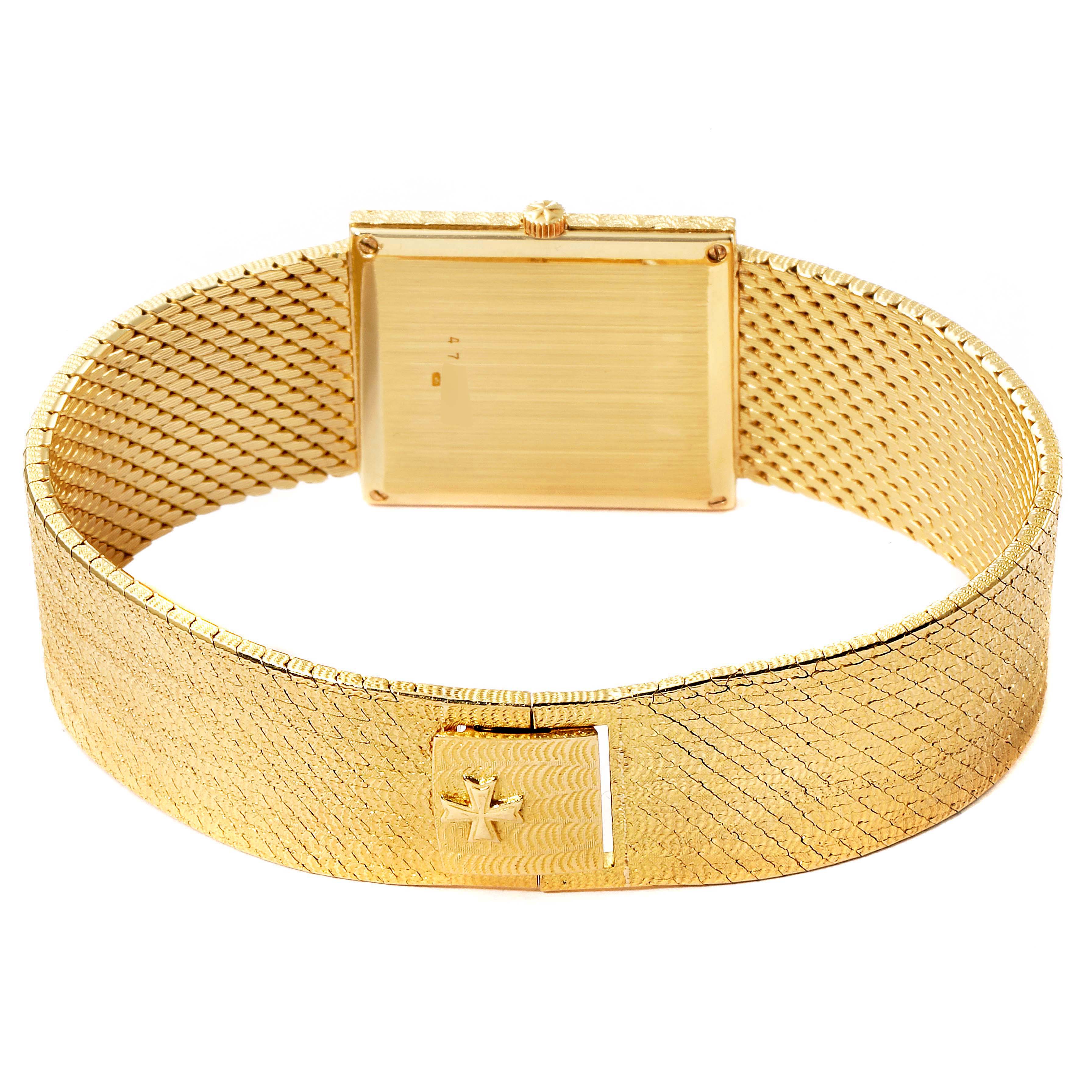 The image shows the back view of a Vintage Vacheron Constantin watch, highlighting the gold bracelet and clasp.