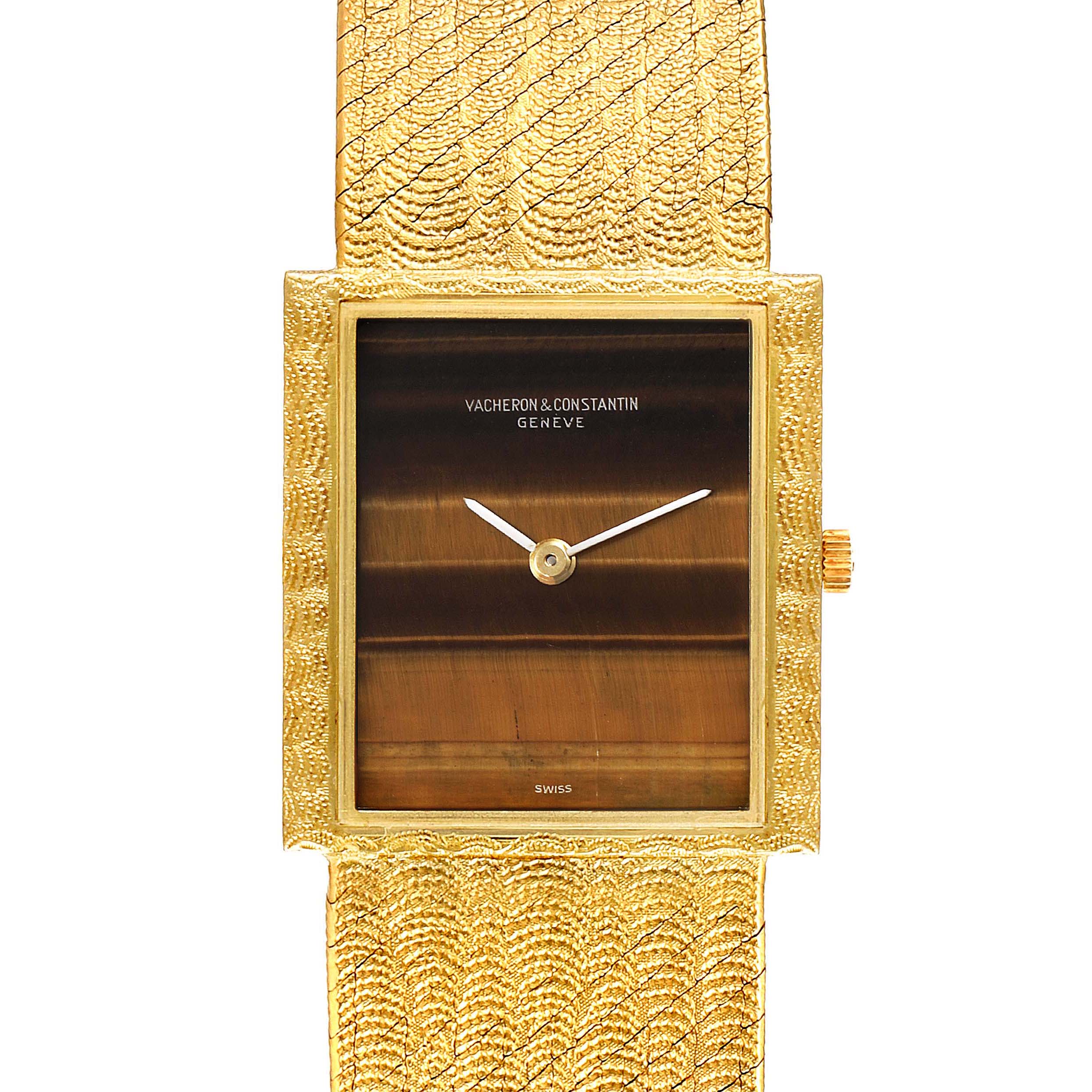 The image shows a frontal view of a vintage Vacheron Constantin watch, highlighting its textured gold bracelet and dial.