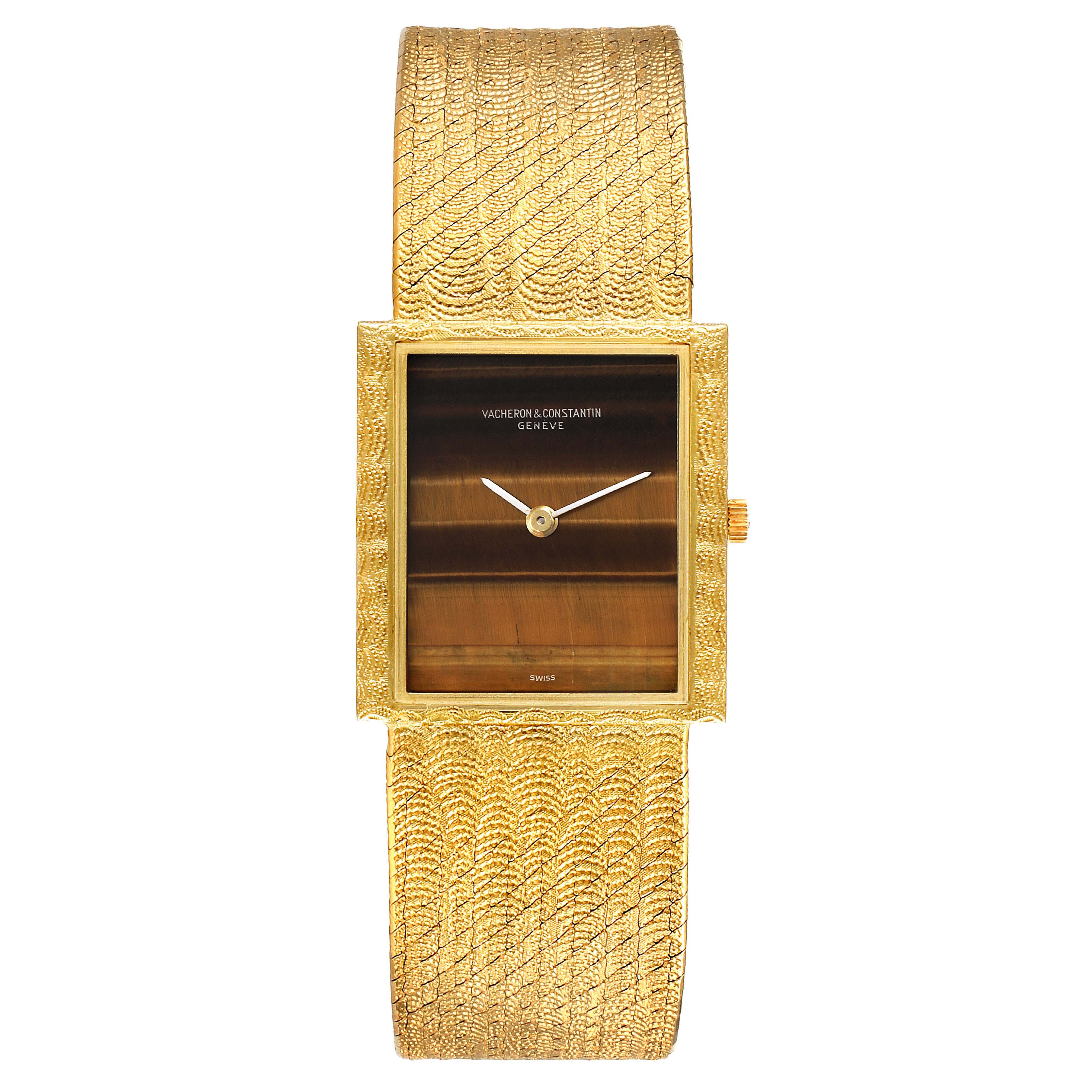The image shows a front view of a Vintage Vacheron Constantin watch, featuring a rectangular dial and textured gold band.